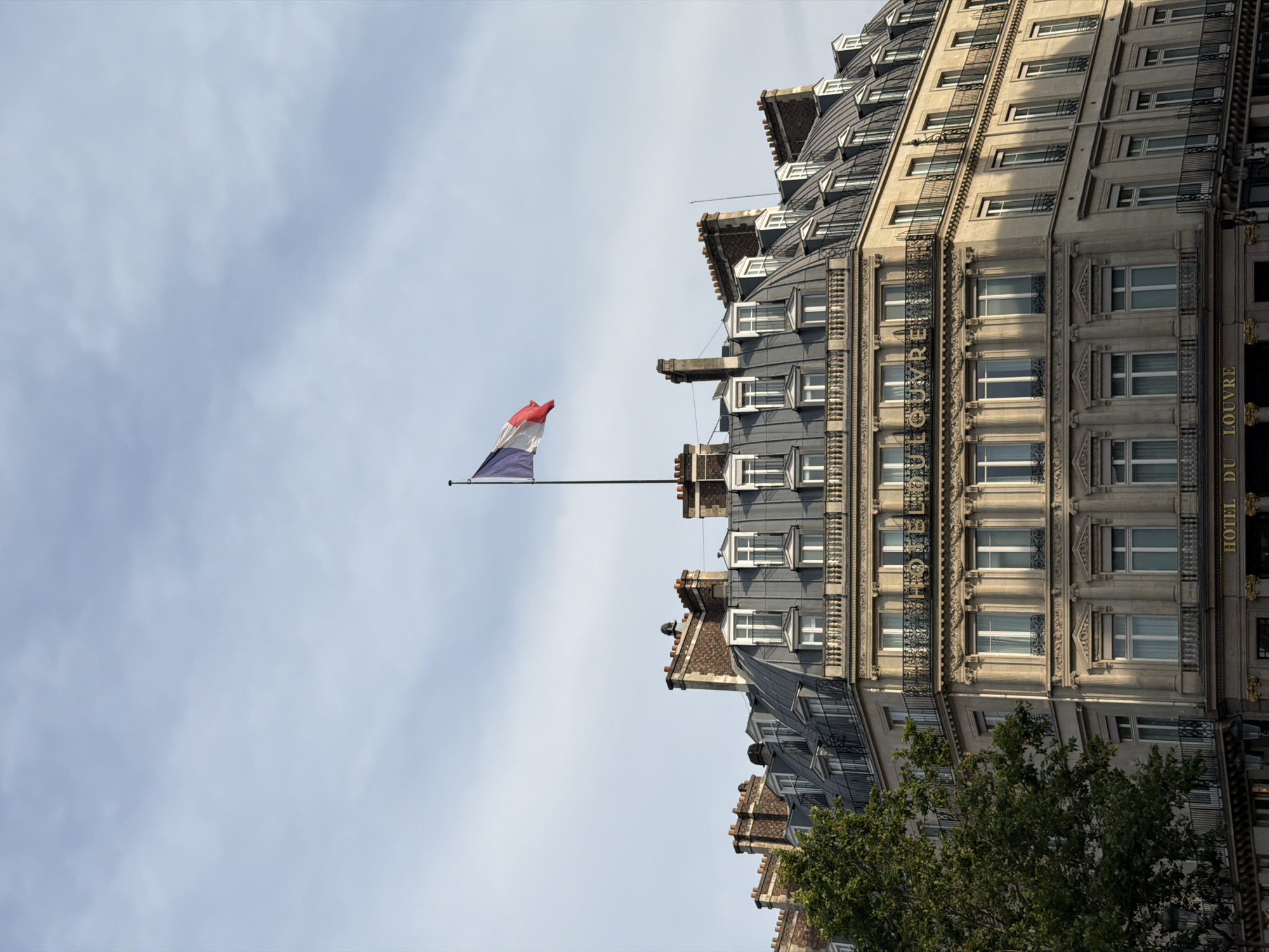 Street-level Paris: Hôtel du Louvre and Haussmannian boulevard