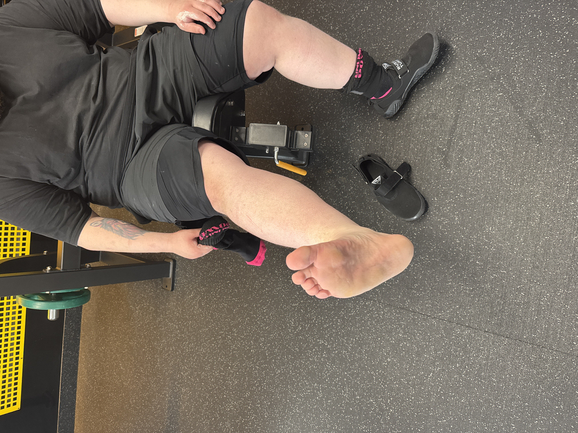 Men document weight training session at gym facility