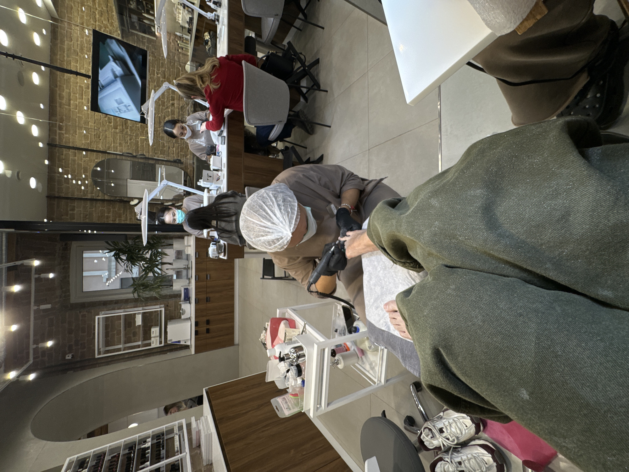 Client perspective captured at nail salon beauty studio