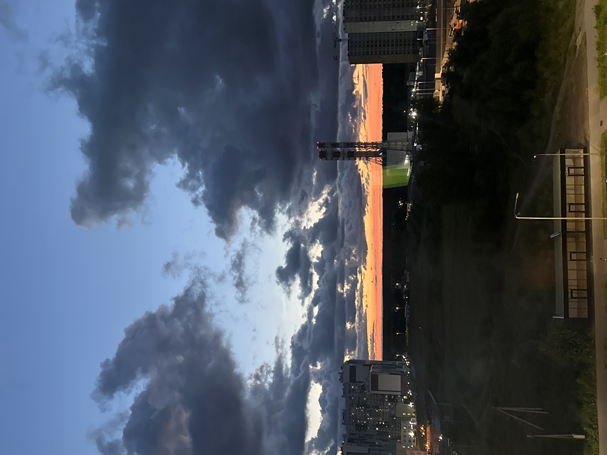 Dramatic summer sunset clouds over Saint Petersburg's urban fringe