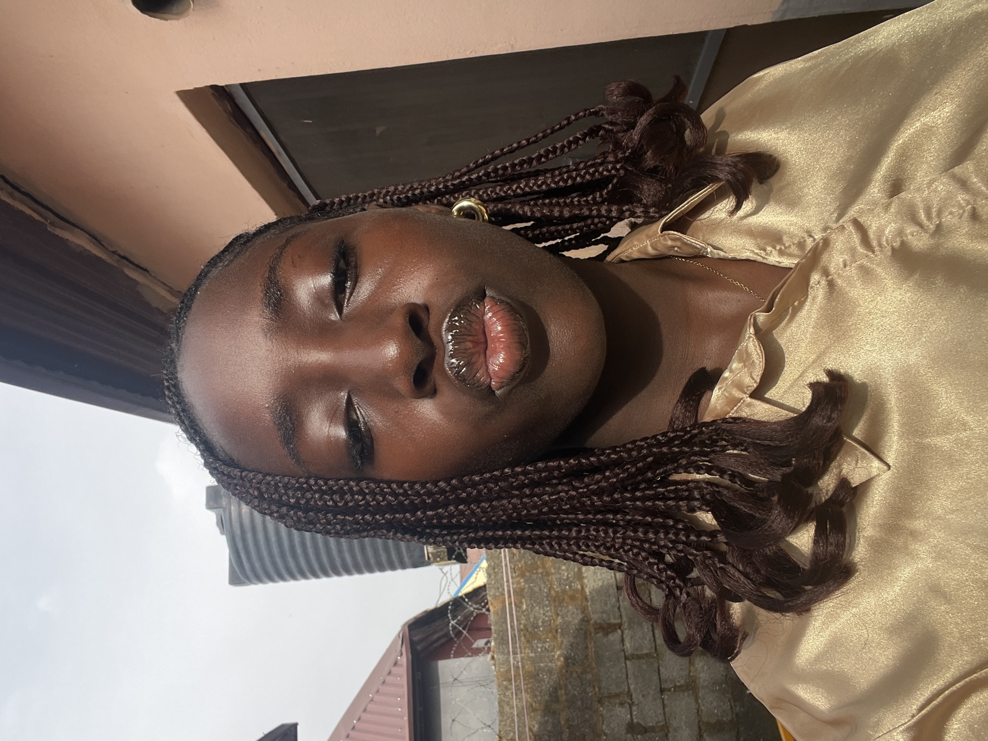 Woman photographed in gold attire in Abuja morning session