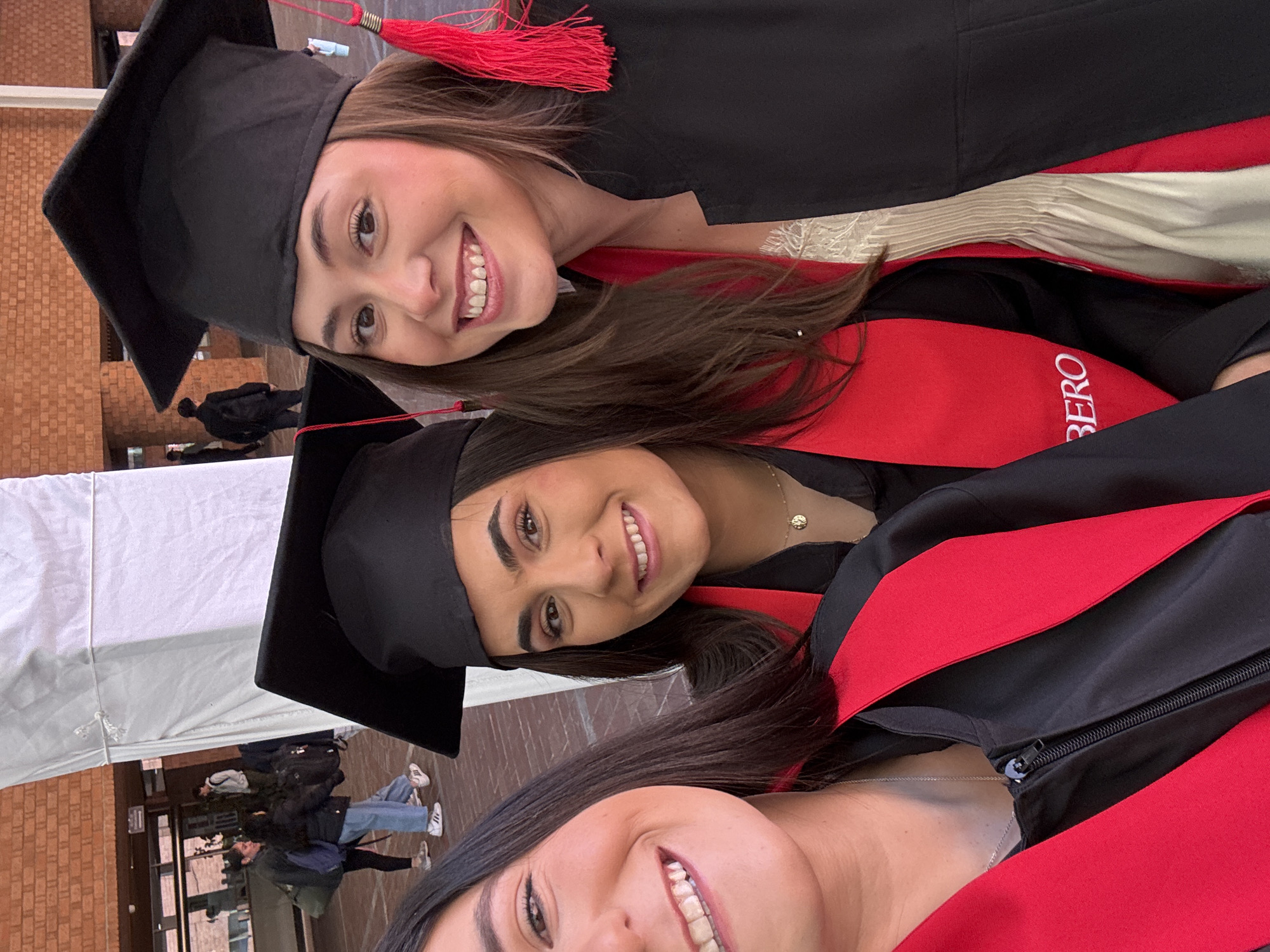 Three graduates celebrate with selfie in Mexico City
