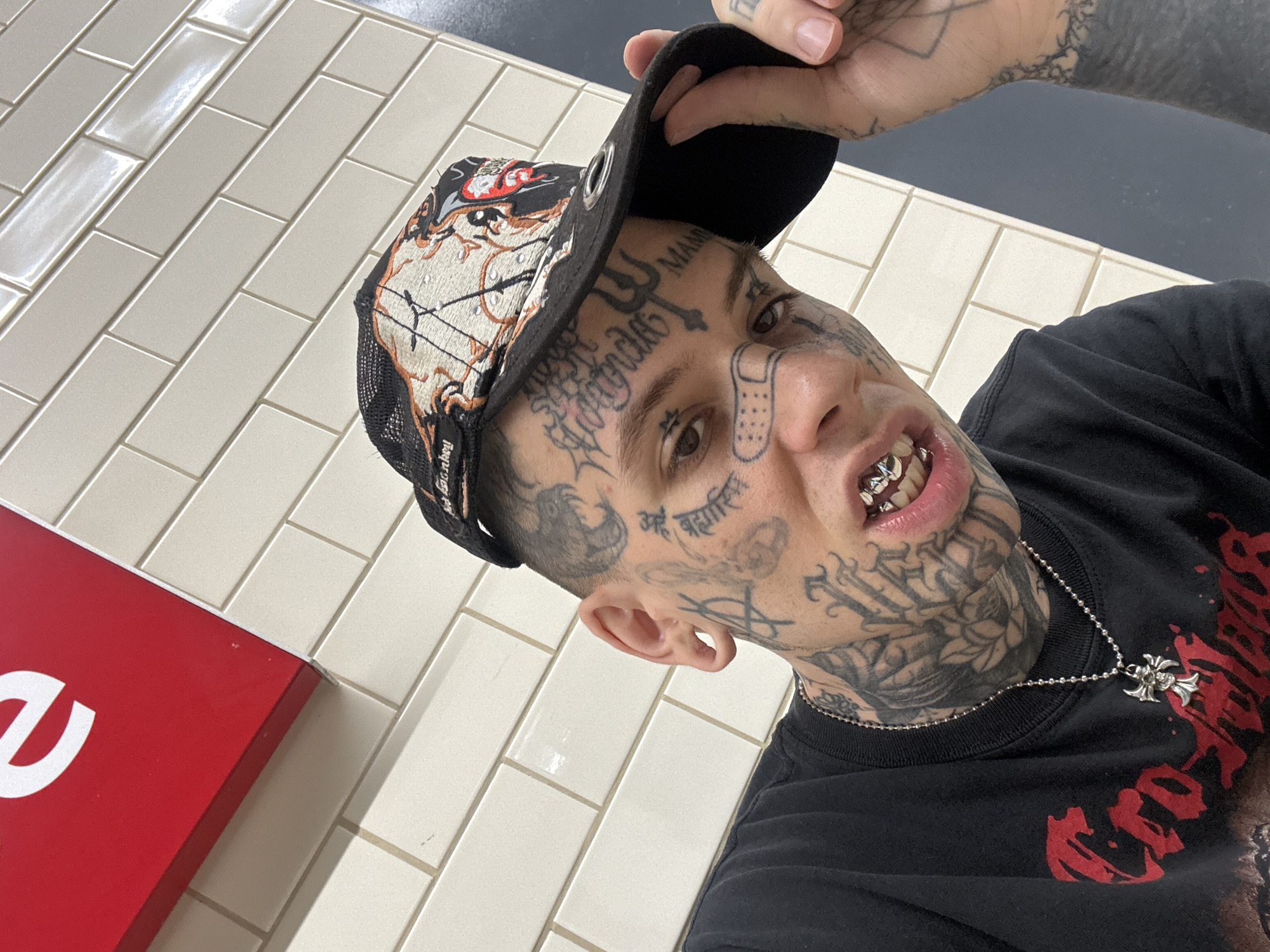 Tattooed man takes selfie in Buenos Aires