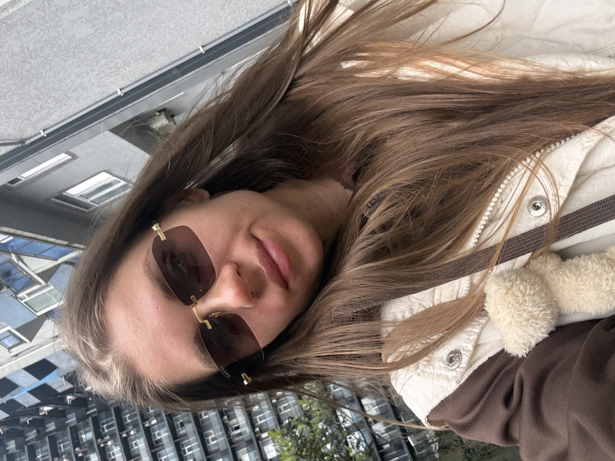 Woman takes selfies in elevator and outdoors in Batumi