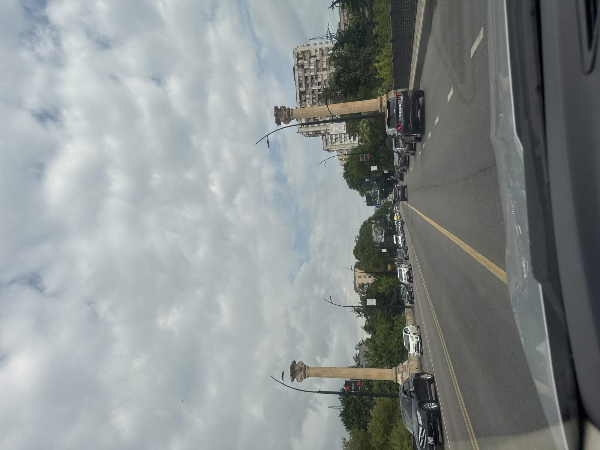 Woman takes selfies while driving in Tbilisi traffic
