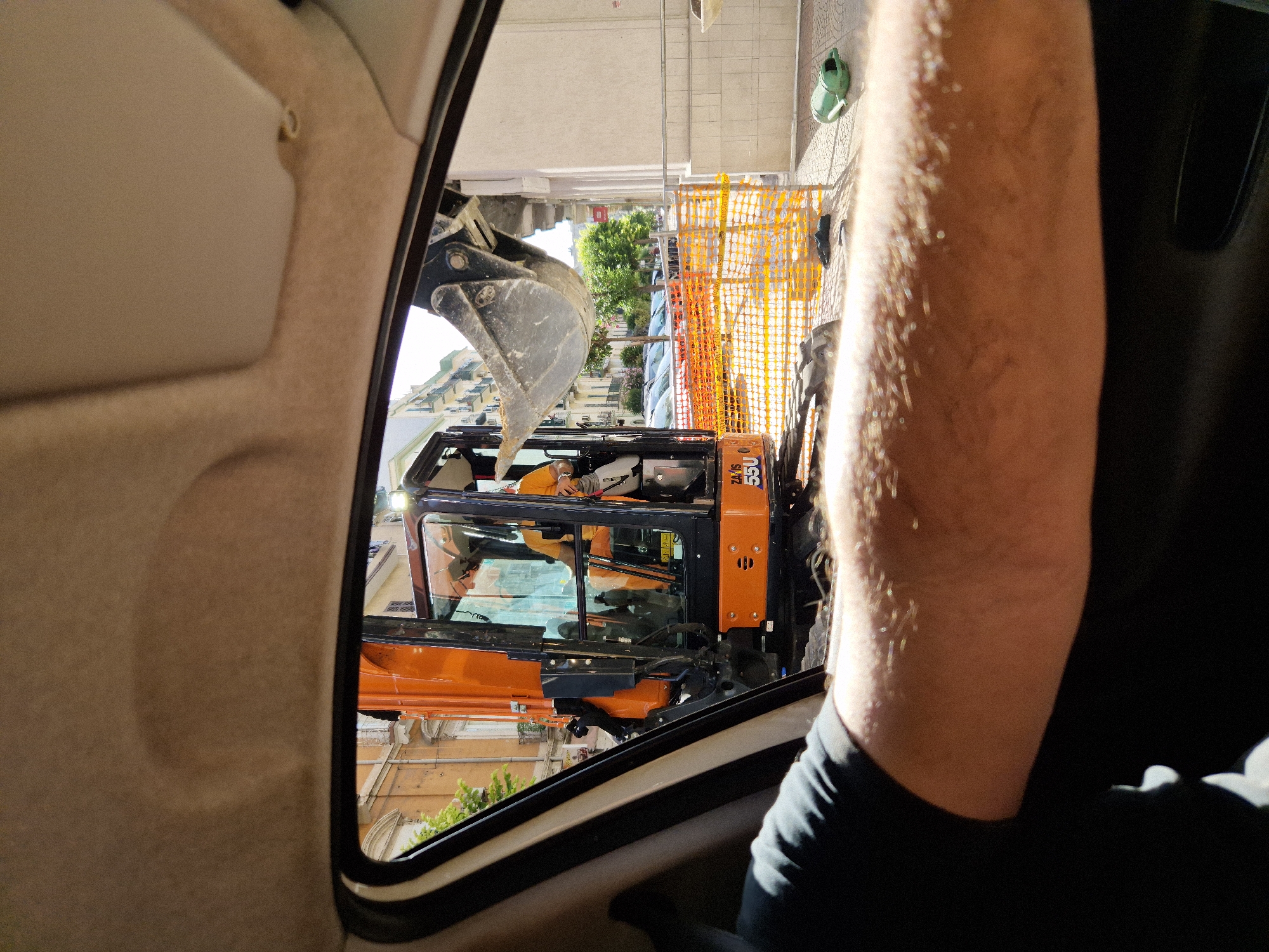 Passing a Taranto construction site, excavator at work