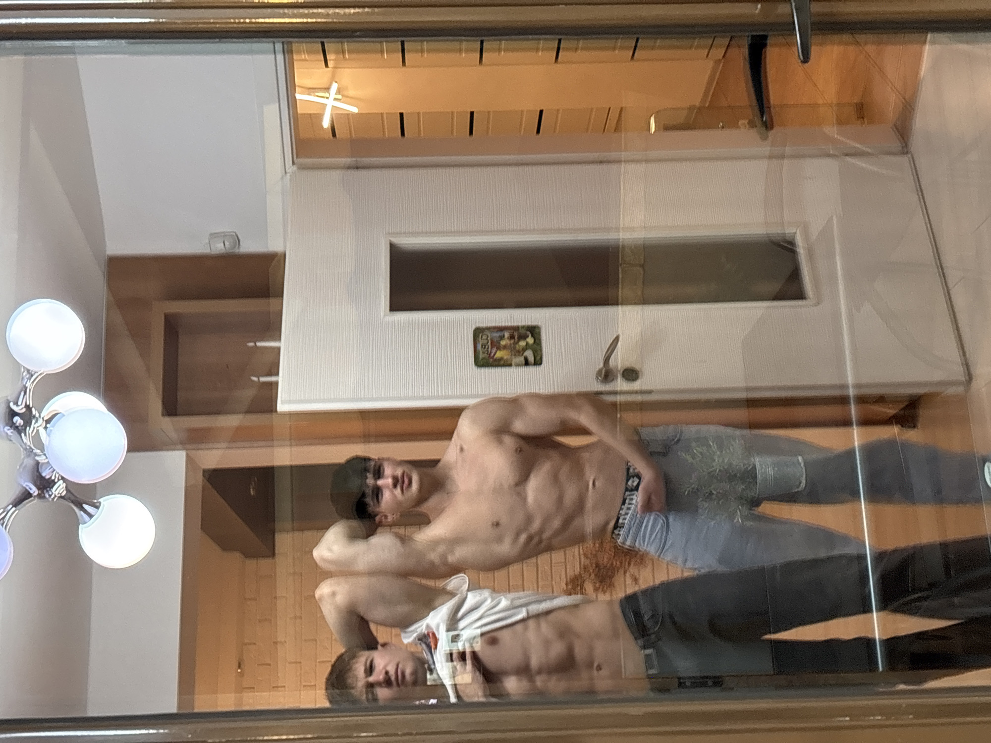 Young men take mirror selfies in Plovdiv home