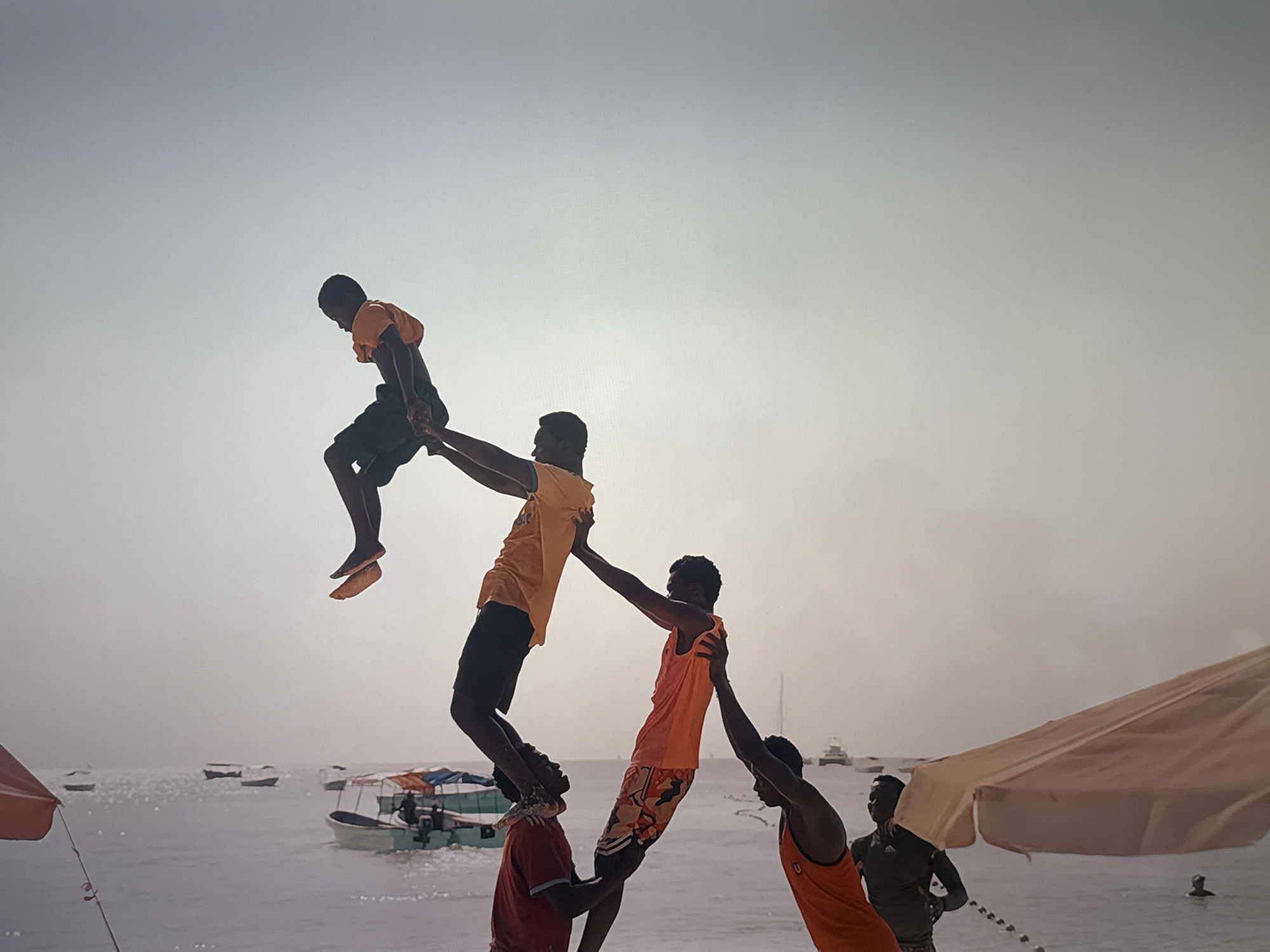 Acrobatic pyramid performance and rainy window views