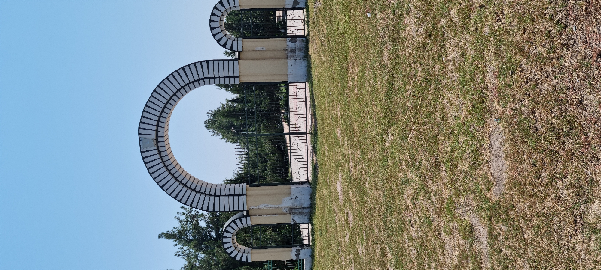 Gateways and open fields in Ismoili Somoni, Tajikistan