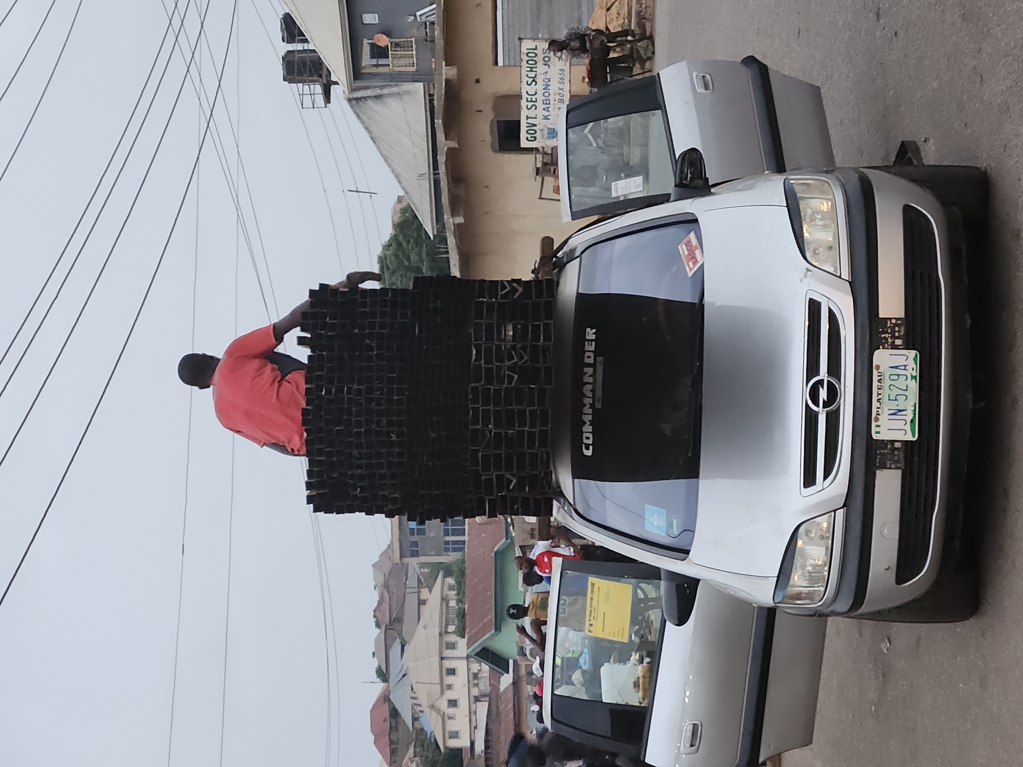 Recycling materials loaded onto vehicles in Kabong, Nigeria