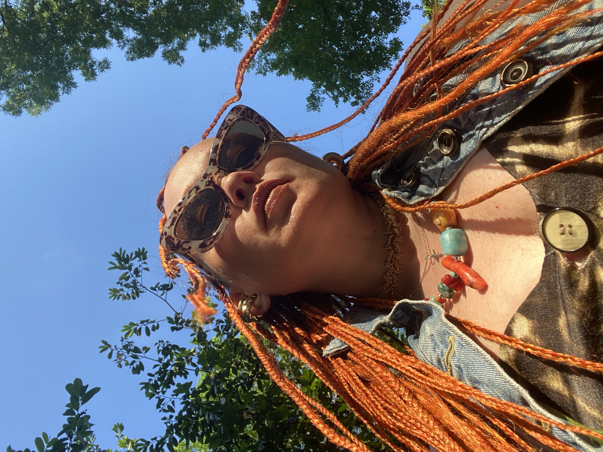 Tourist with orange braids visits Sochi landmarks, fountains