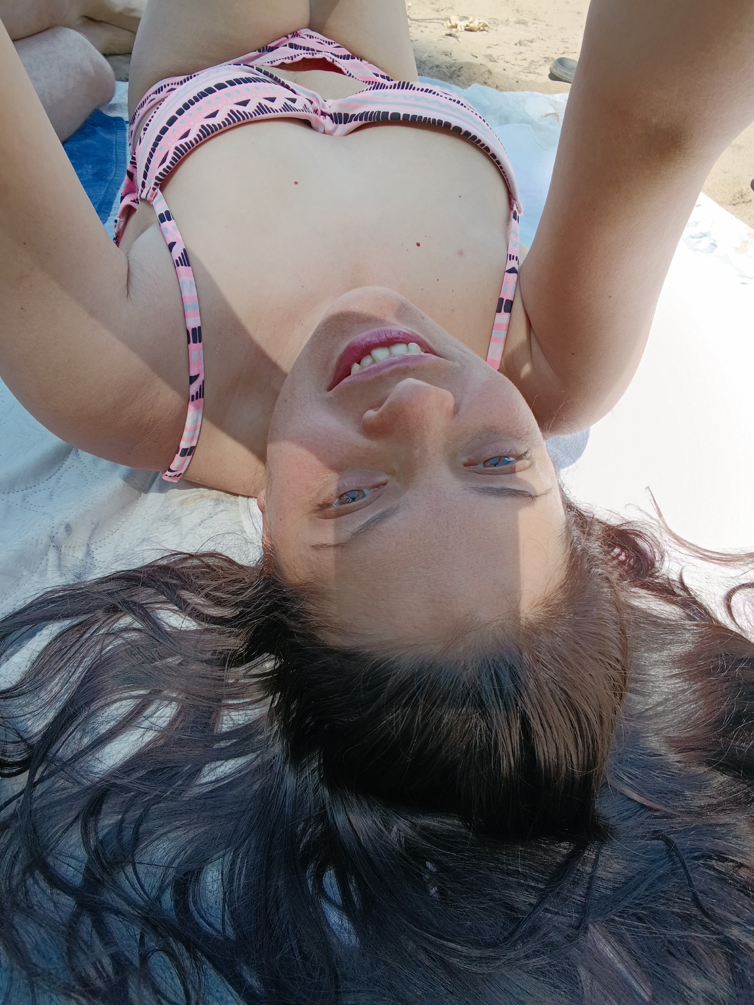 Beach sunbathing and water activities documented by witnesses