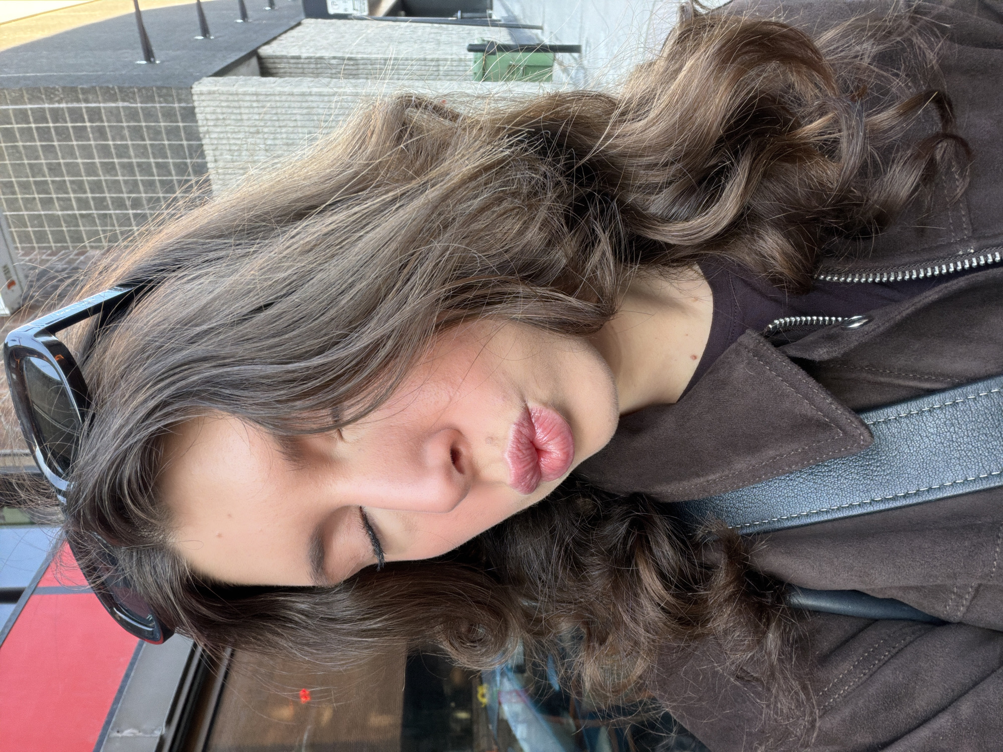 Woman poses for playful portrait in downtown Montreal