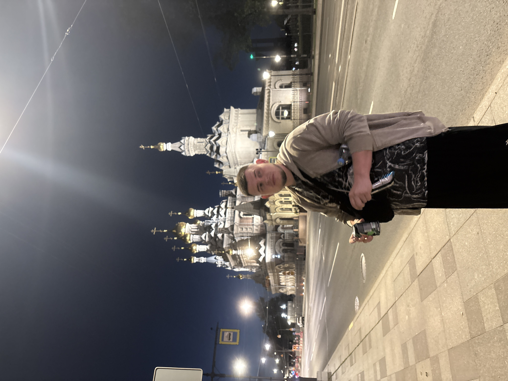 Golden-domed Orthodox church glowing at night in Saint Petersburg