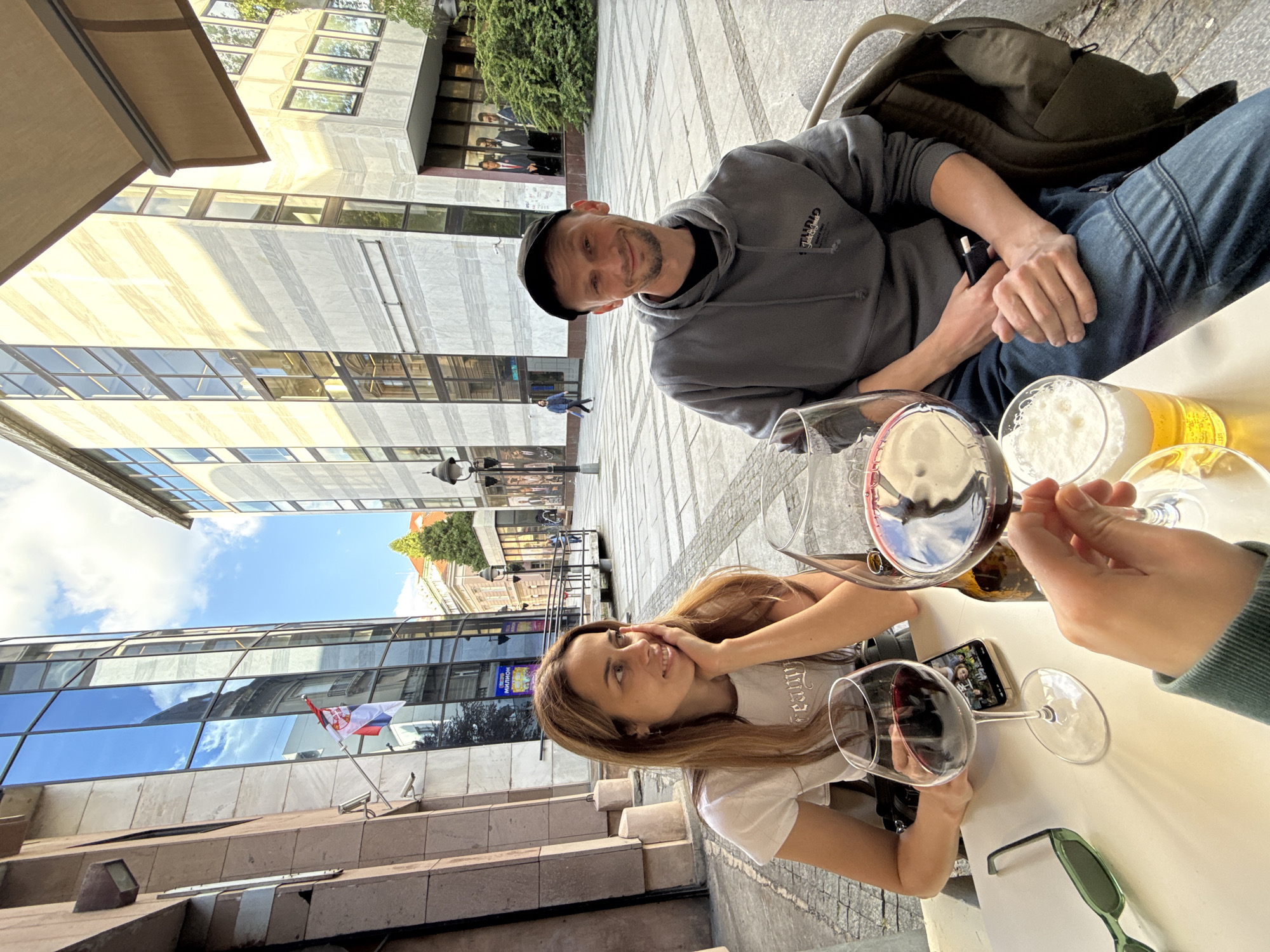 Friends gather for drinks at Belgrade outdoor cafe