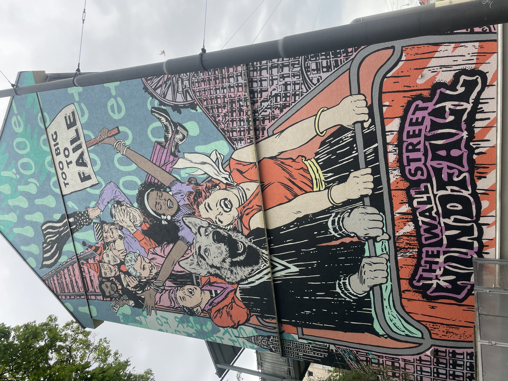 Mural depicting diverse crowd with protest sign spotted in Munich