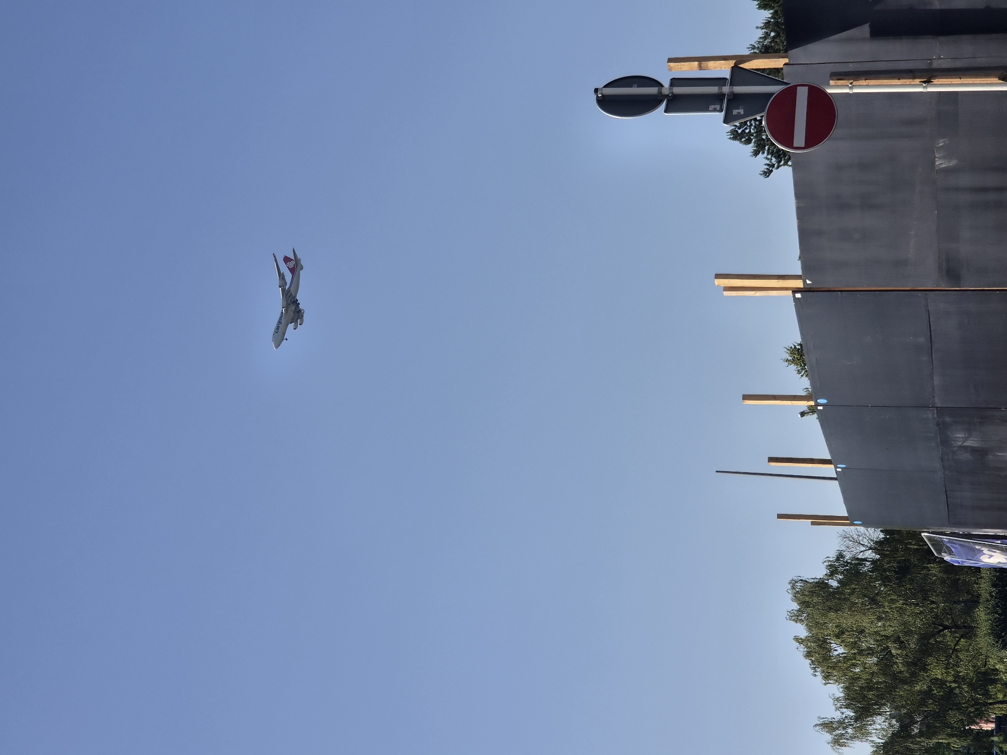 Cargolux flight and church steeple on a clear Luxembourg morning