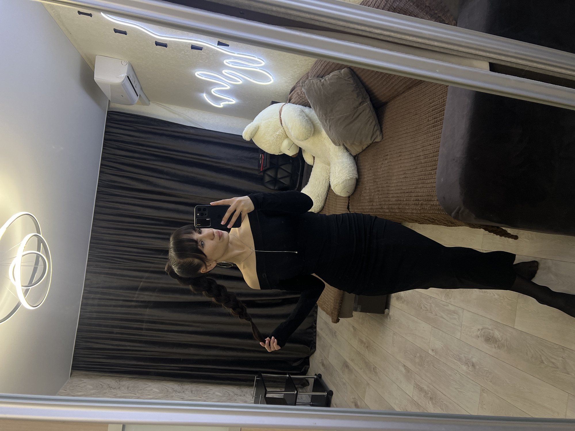 Woman takes mirror selfies in black dress, Votkinsk