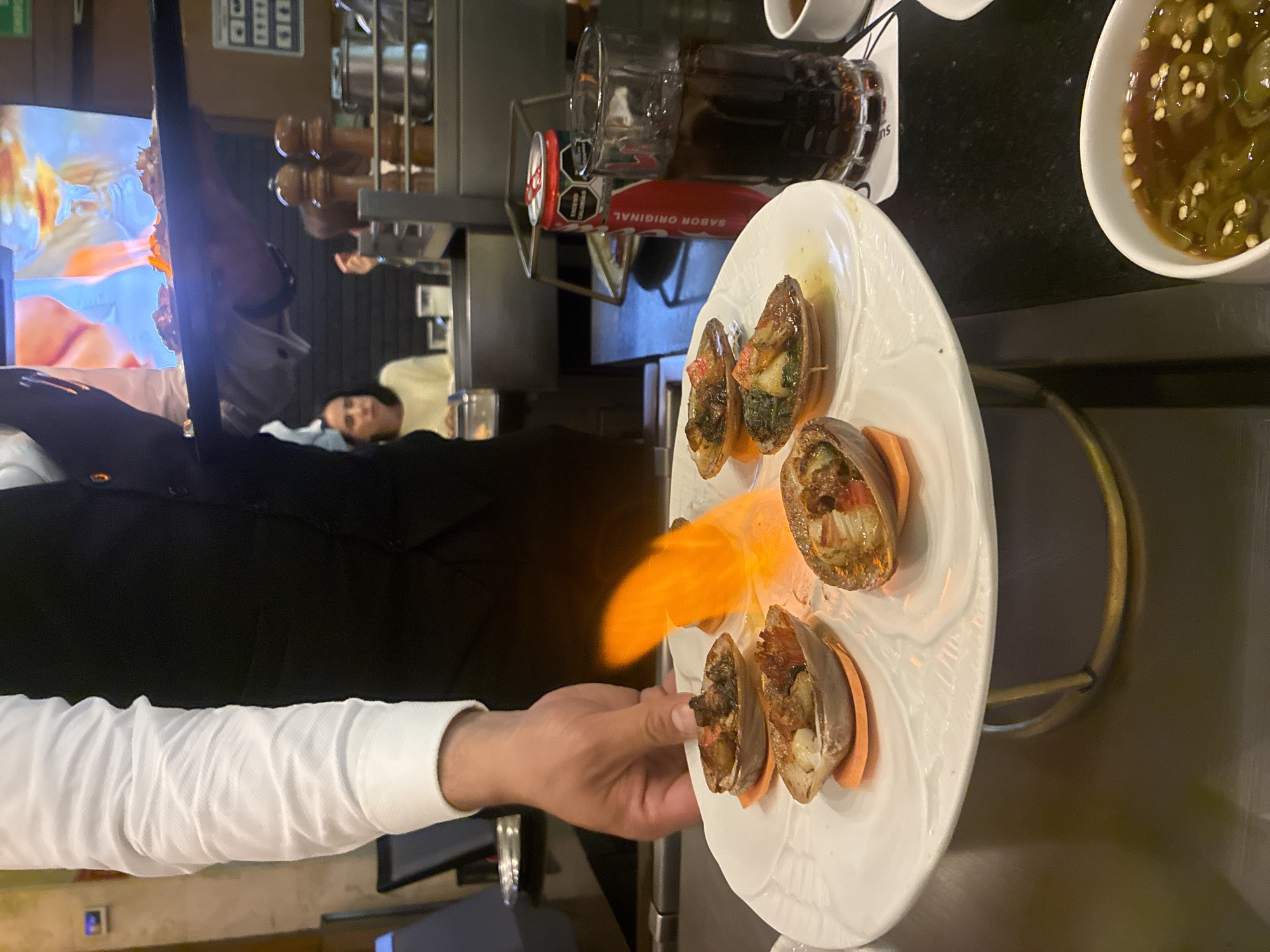 Tableside shellfish flambé at a Jesús del Monte restaurant