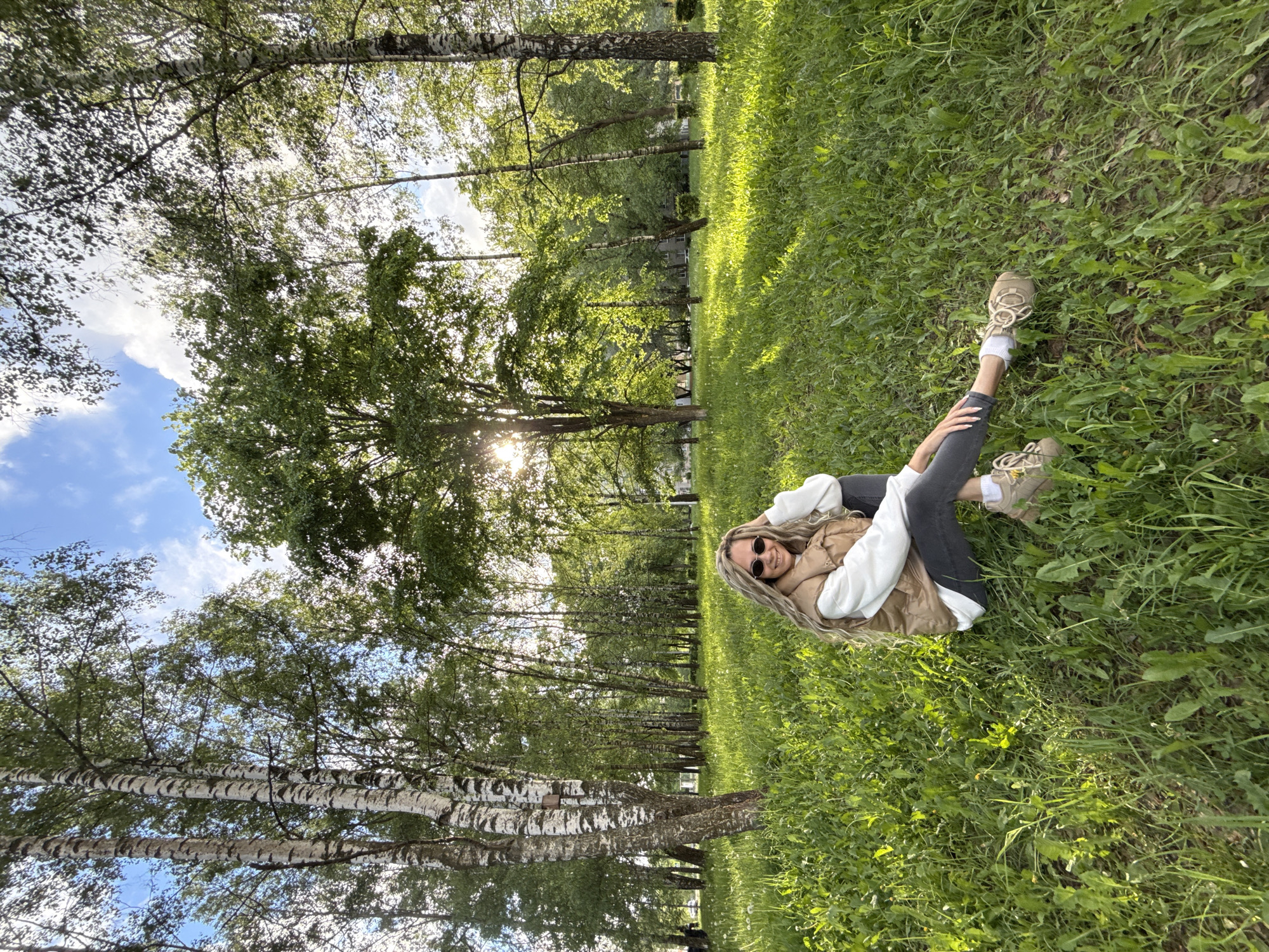 Woman enjoys afternoon relaxation in Rusanovo park, Russia
