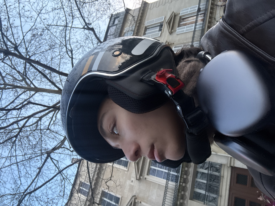 Motorcyclist photographed touring central Paris landmarks during afternoon ride