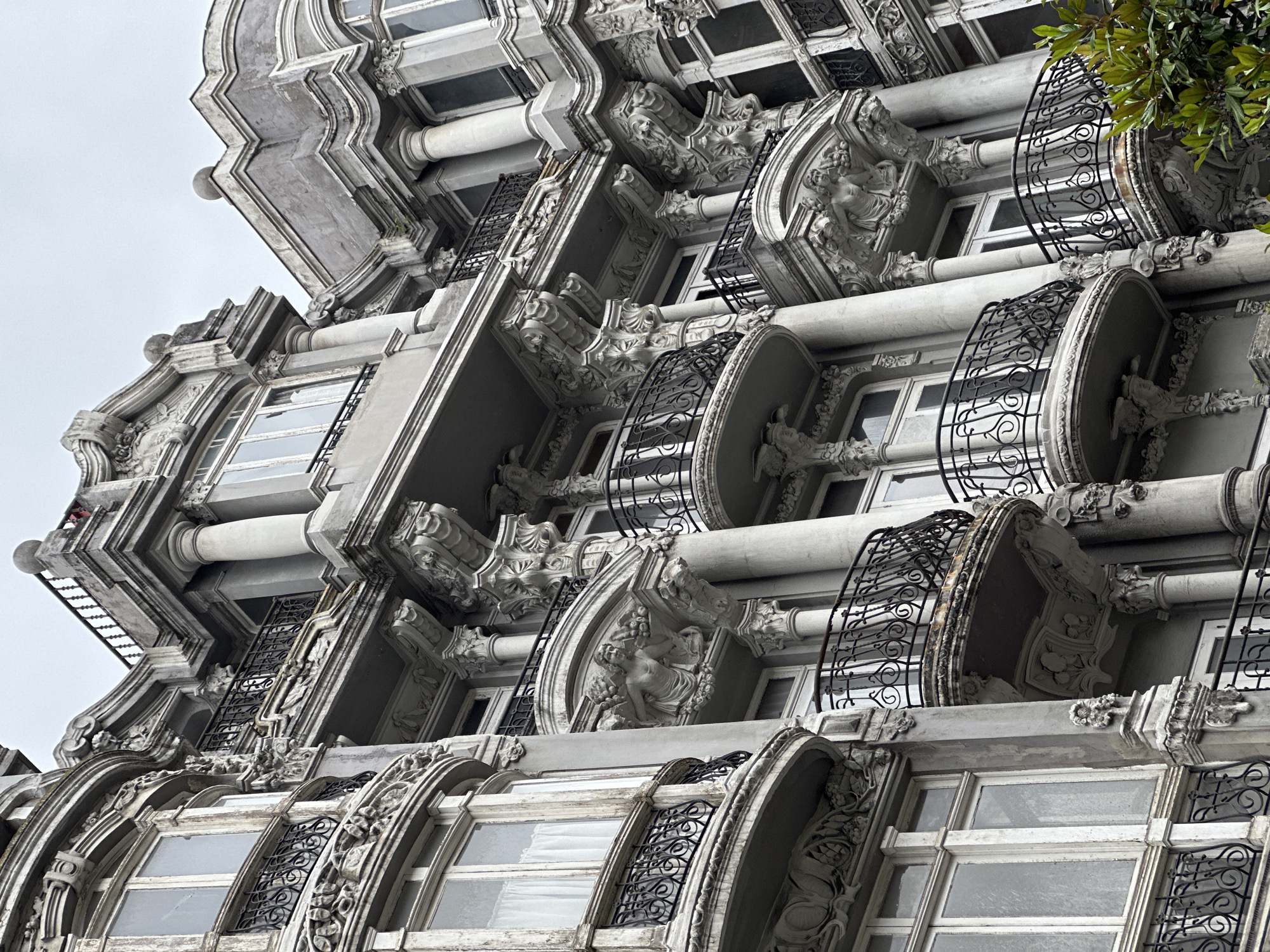 Tourist documents historic Oviedo landmarks and streets in Spain