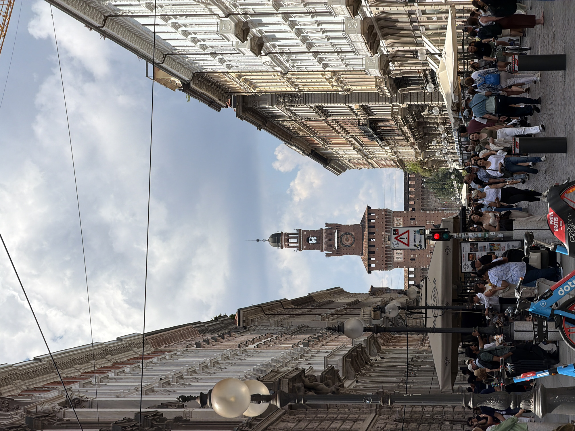 Milan street scene captures Sforza Castle tower view