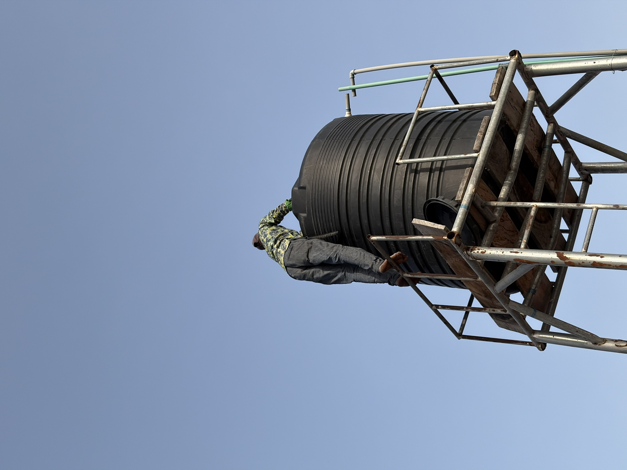Person spotted on water tank in Igboefon, Nigeria