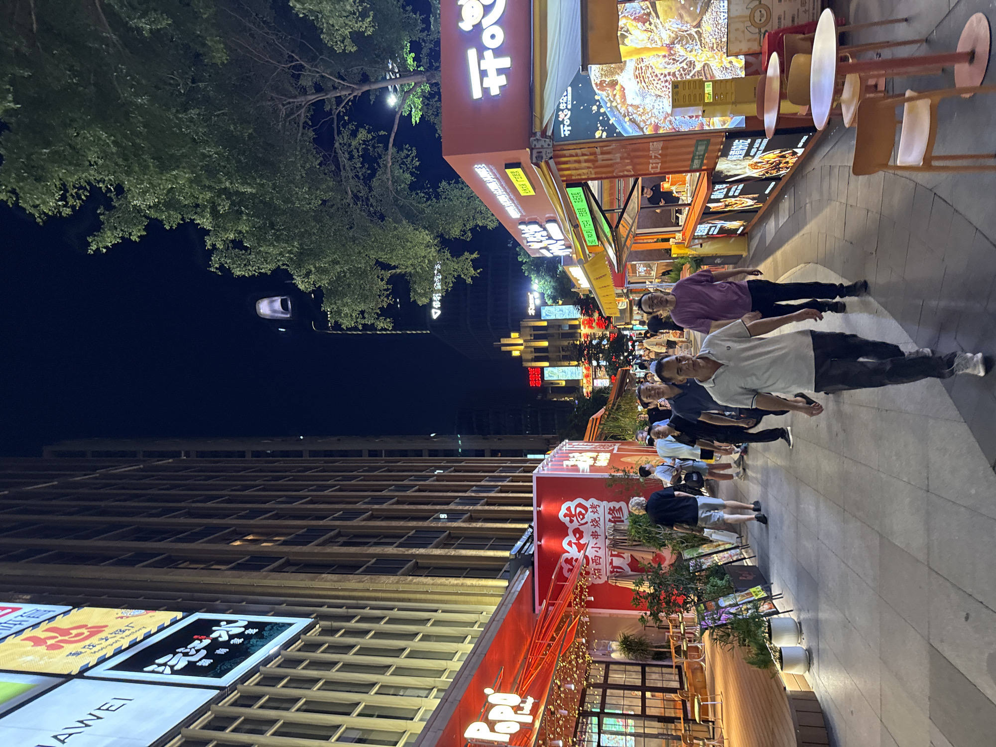 Haizhu District commercial strip buzzing on a summer evening