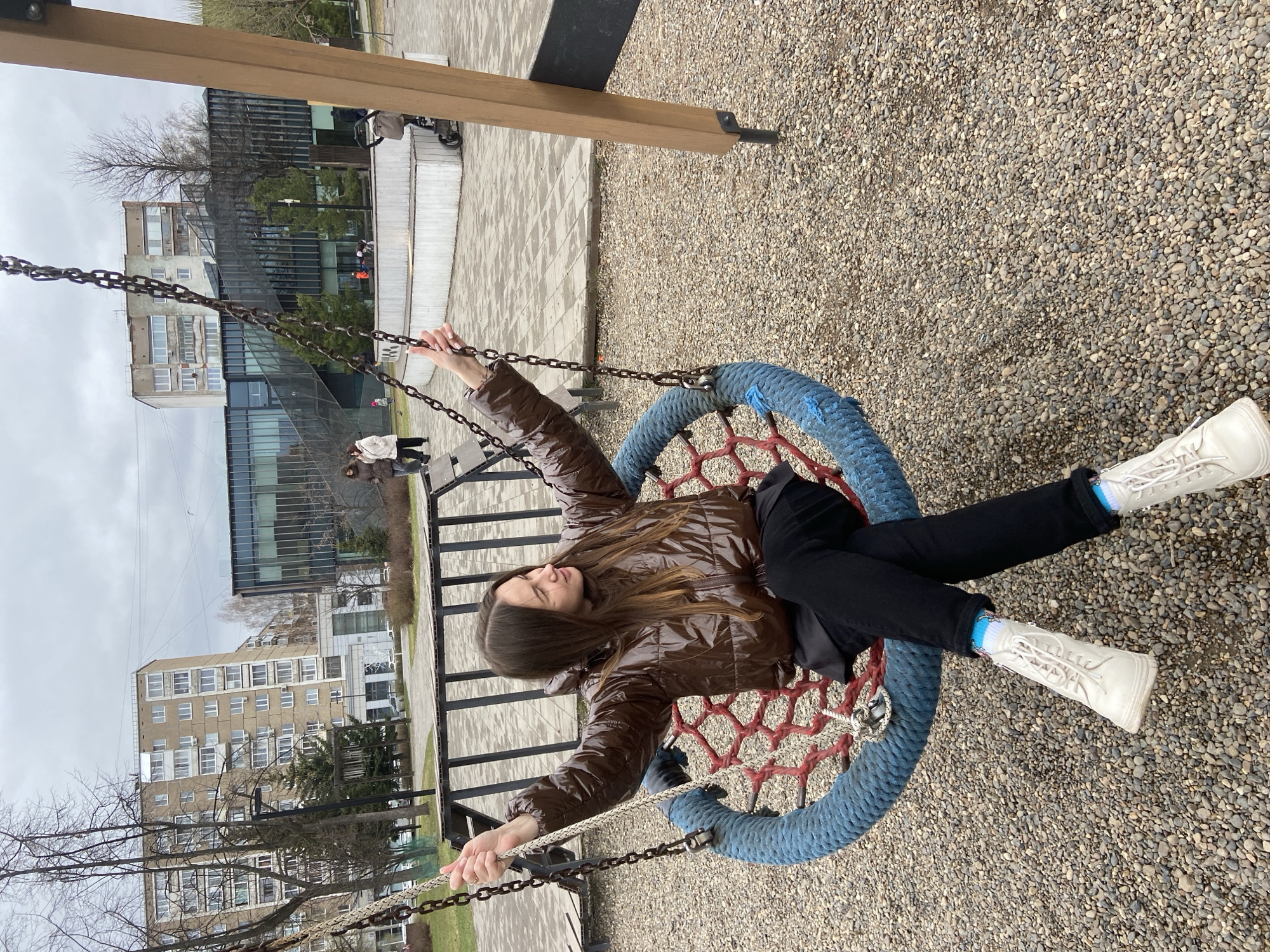 Woman enjoys morning swing time at Izhevsk playground