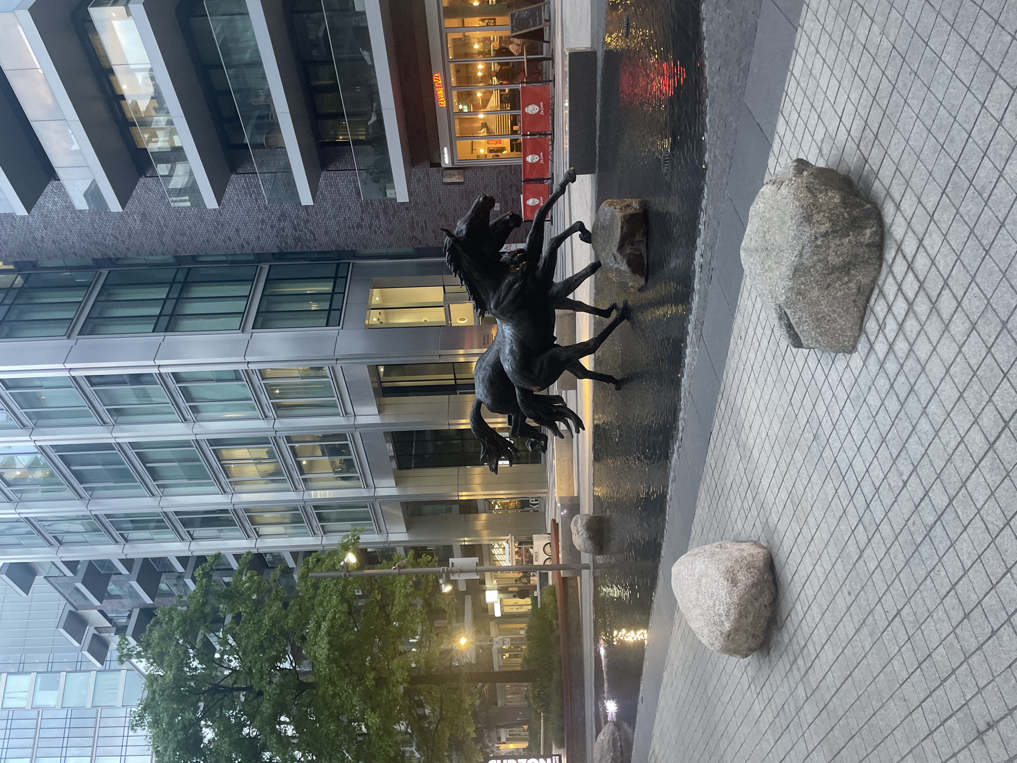 Bronze horse sculpture observed in London water feature