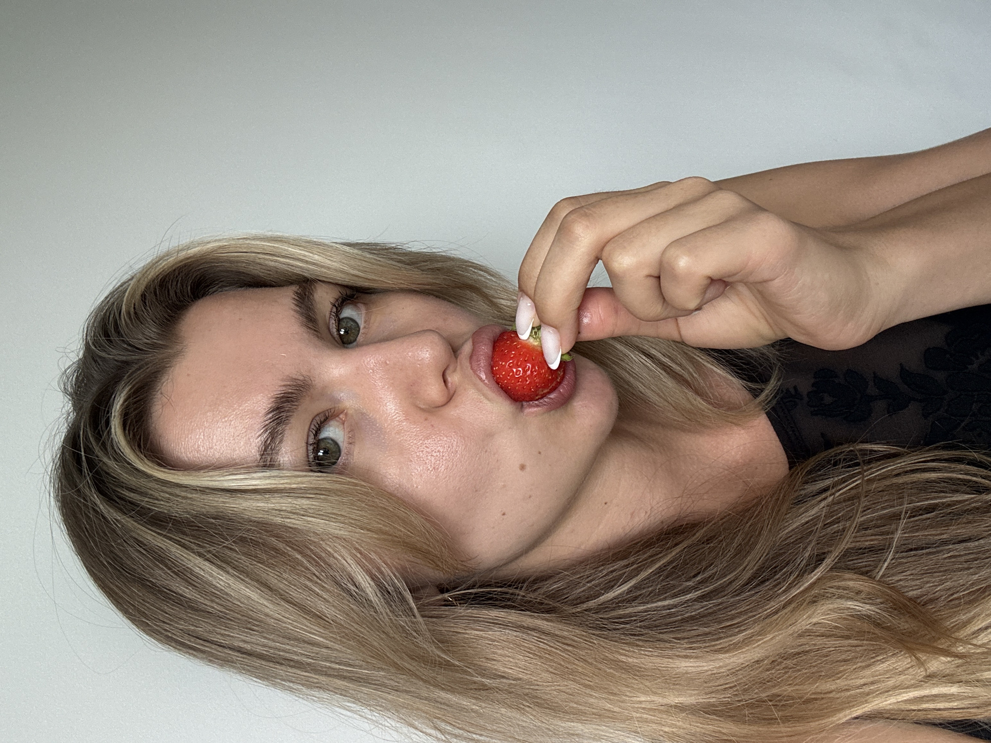 Portrait session captures woman with fruits, flowers, friends
