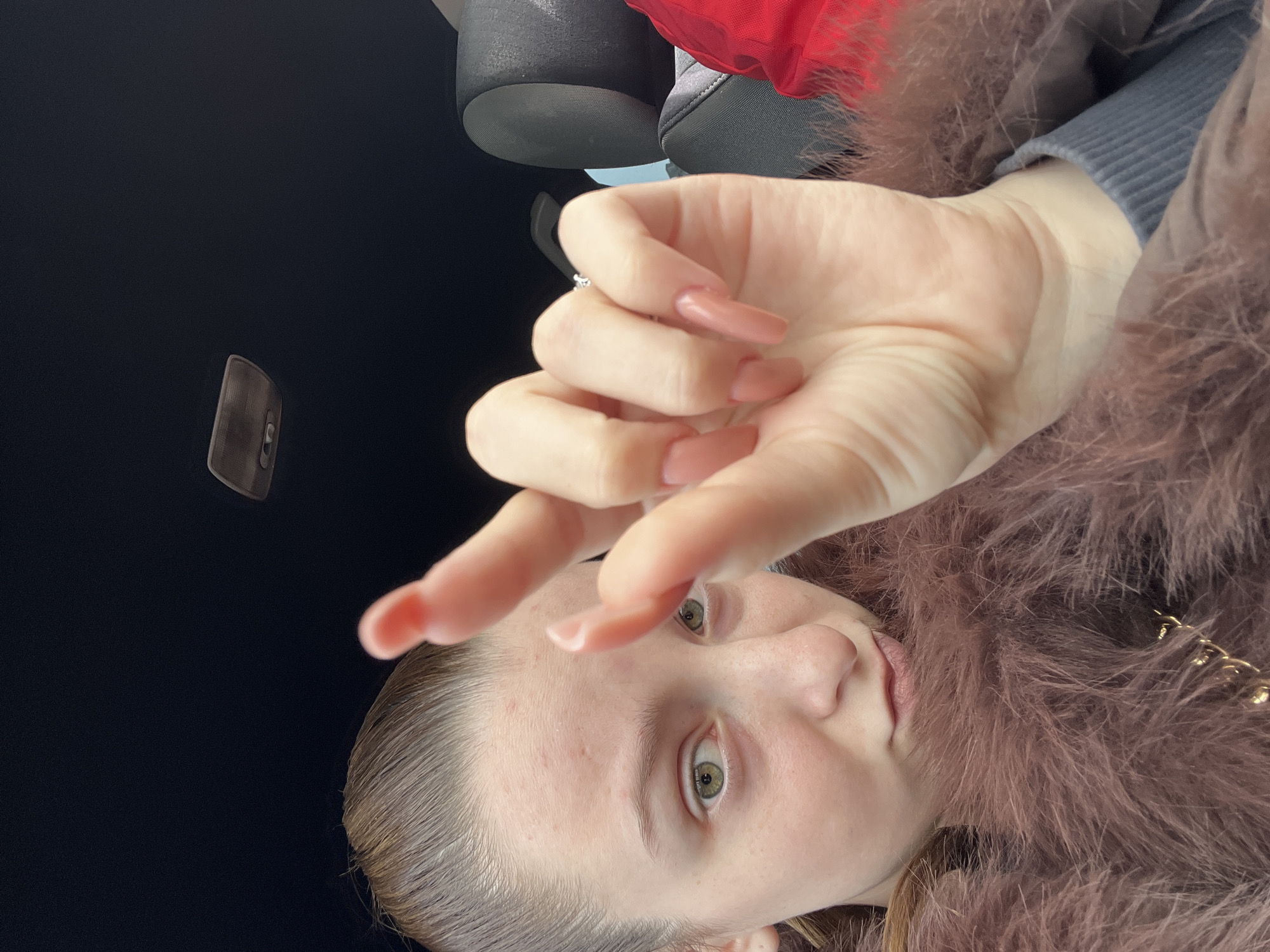 Two people photographed in car during early morning in Varna