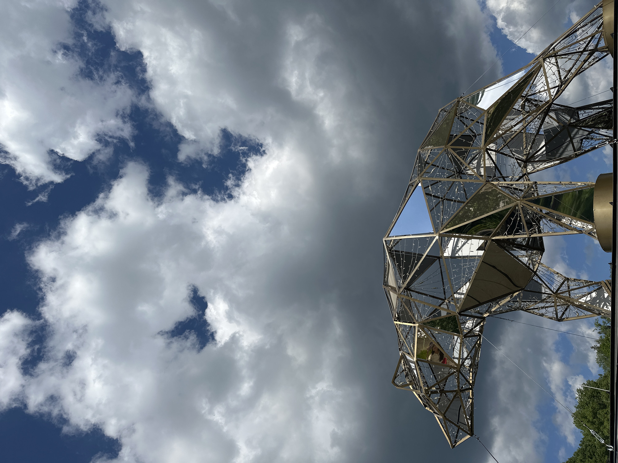 Tourists document geometric sculpture and bridge visits in Wisła