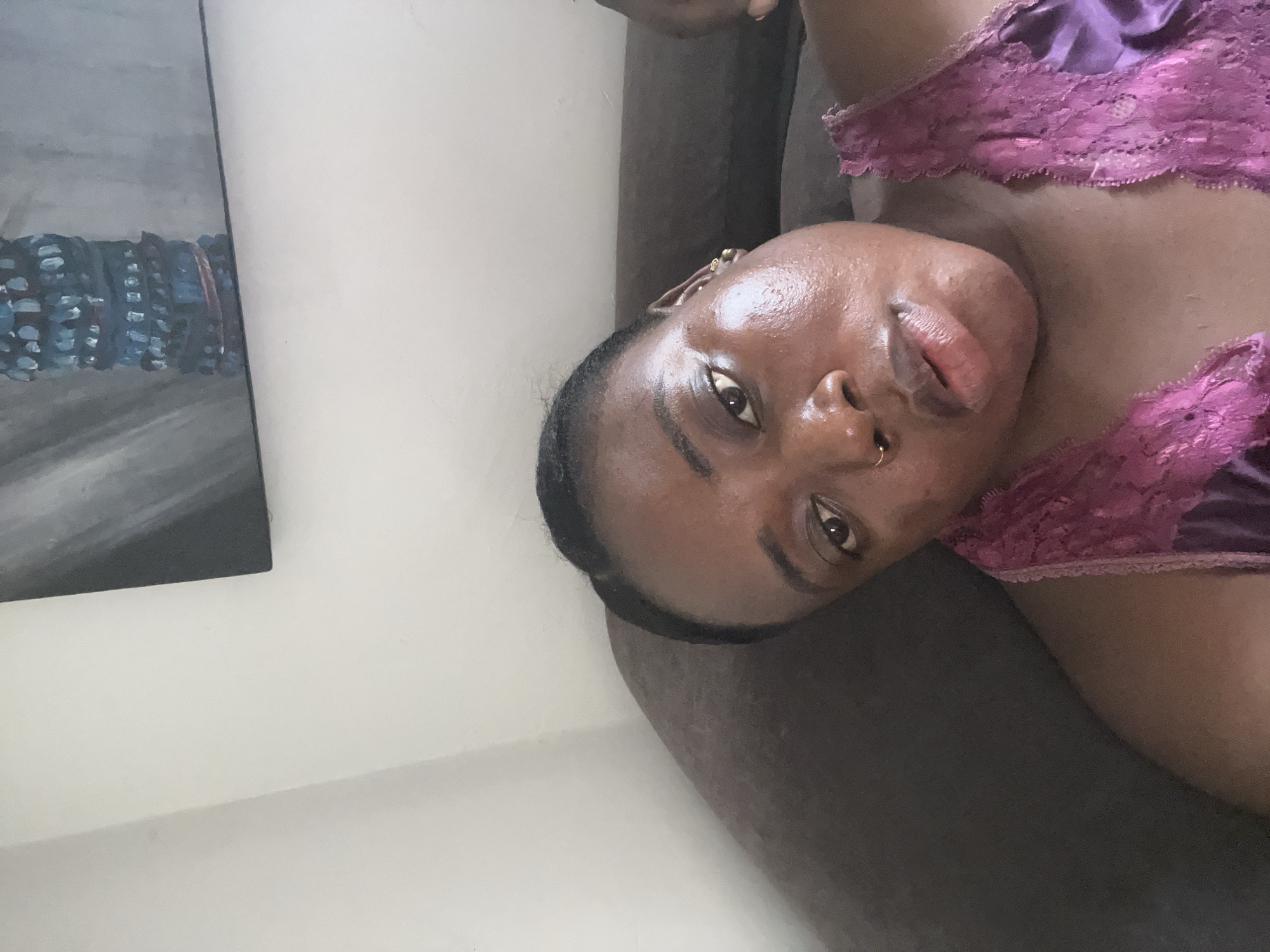 Woman photographed in purple lace outfit at Abuja residence