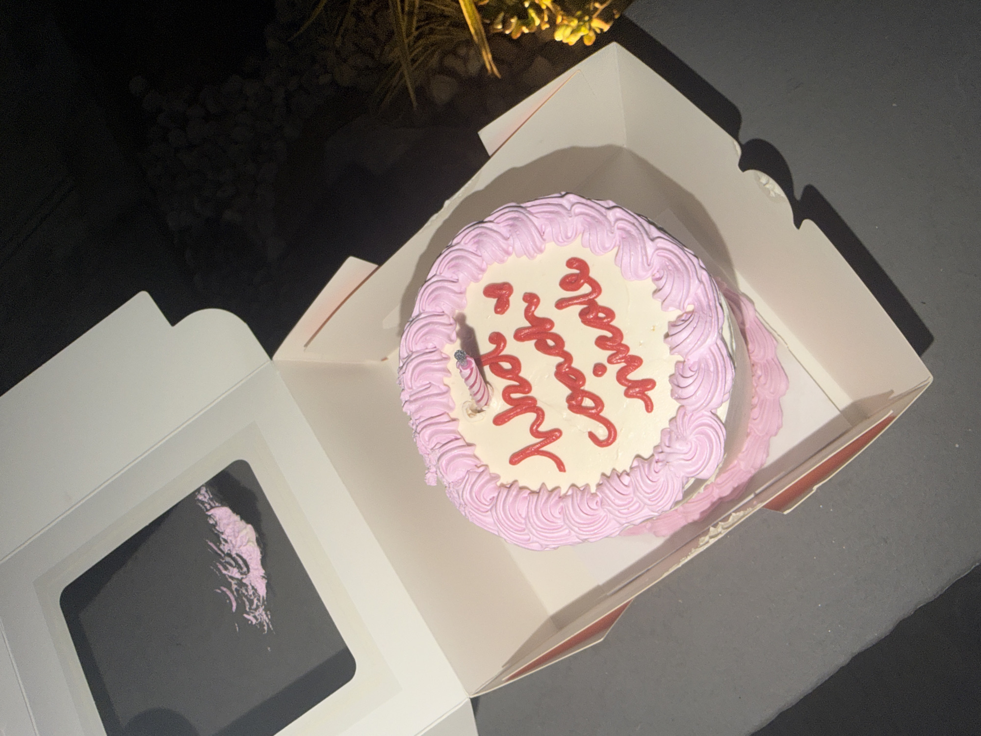 Birthday cake with single candle observed in Mexico