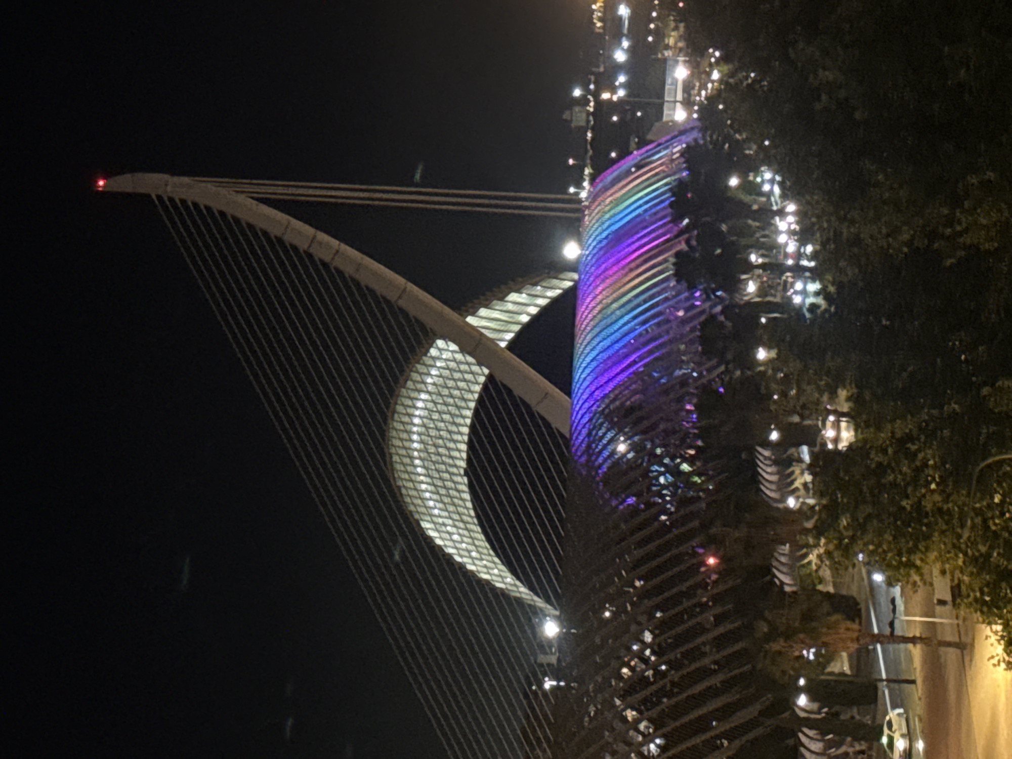 White-clad crowds gather at Valencia's illuminated Arts Sciences complex