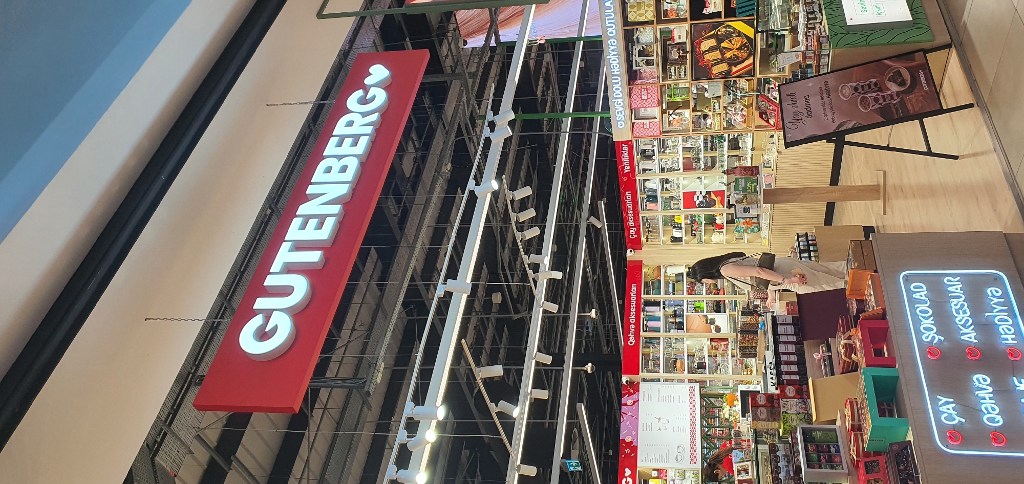 Retail browsing across Baku storefronts, from books to bubble tea