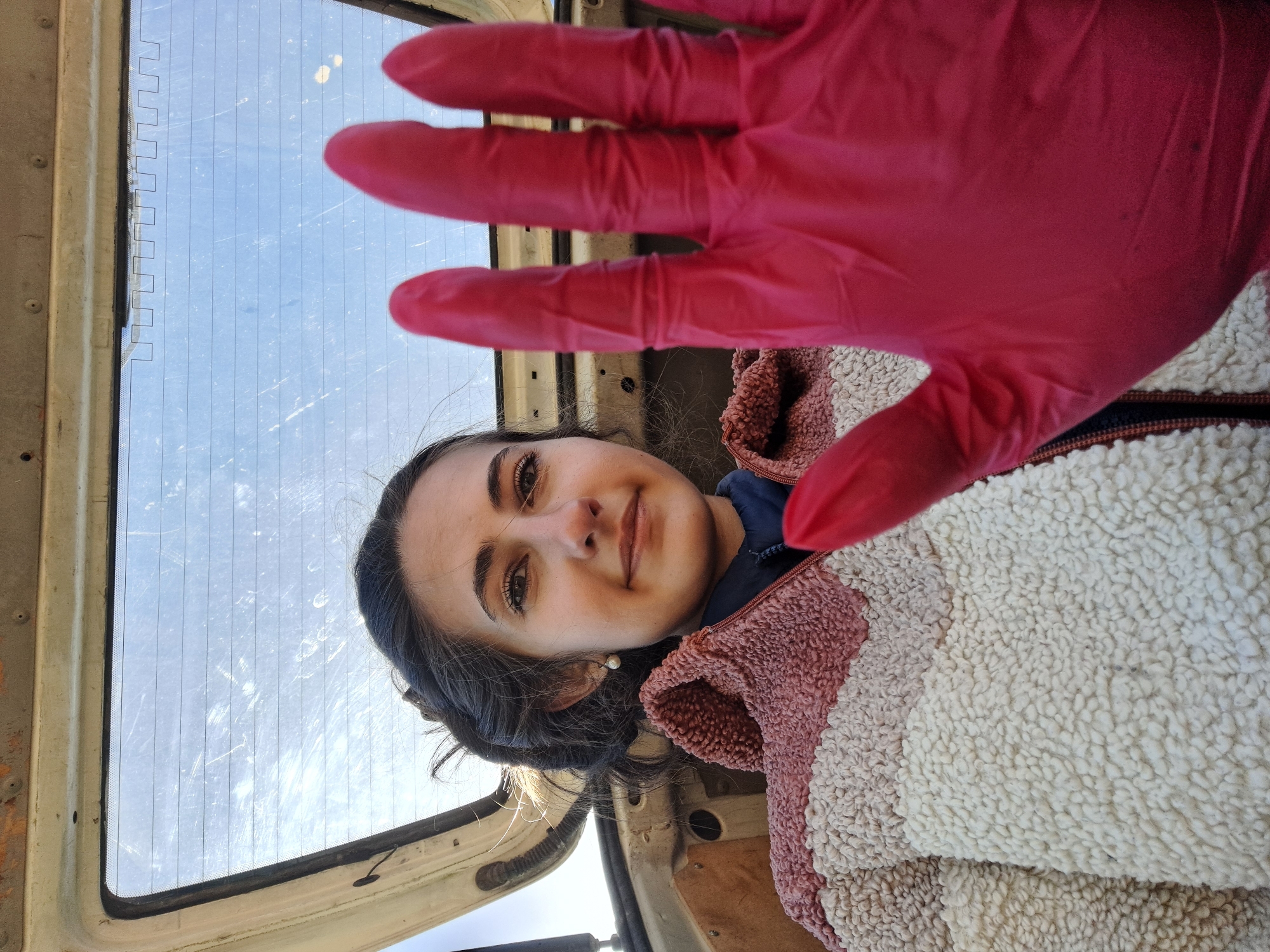 Woman photographed near vehicle in rural Bulgarian village