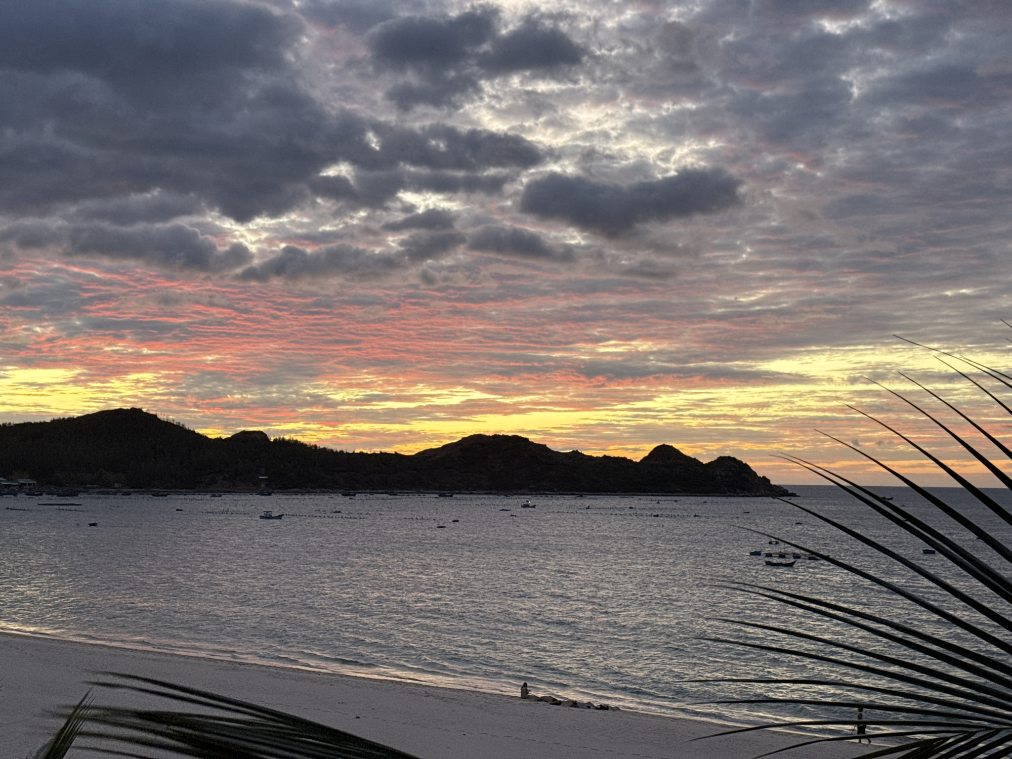 Dramatic coastal sunset, clouds and color over open water