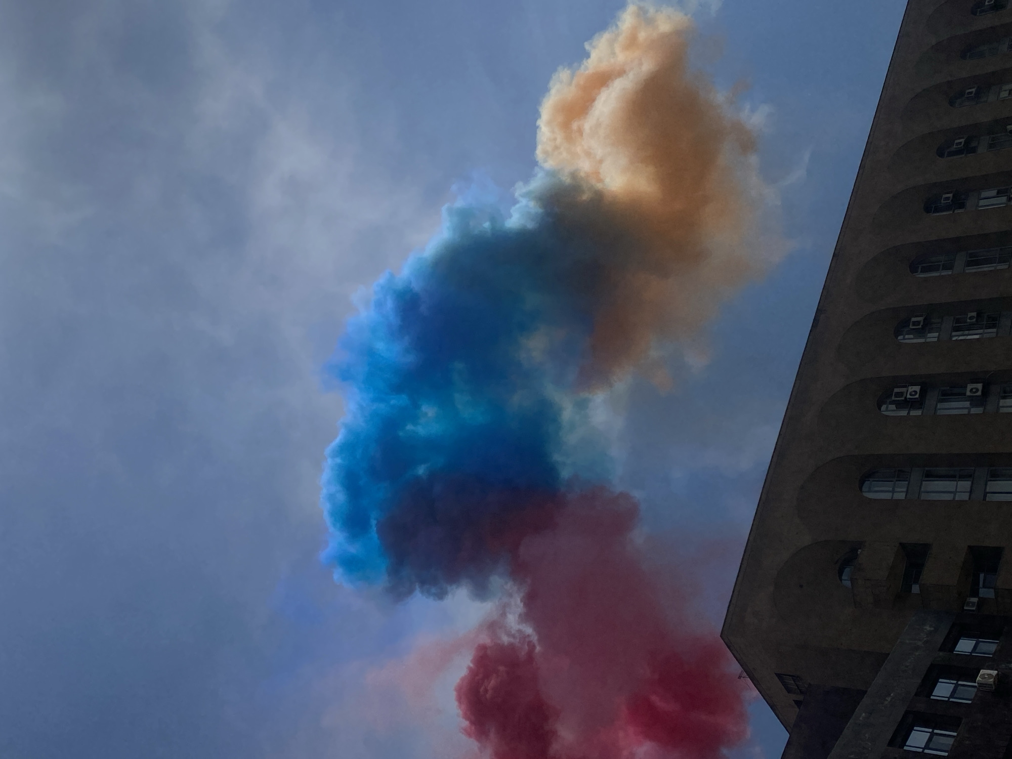 Marching band draws crowds amid colored smoke in Yerevan plaza