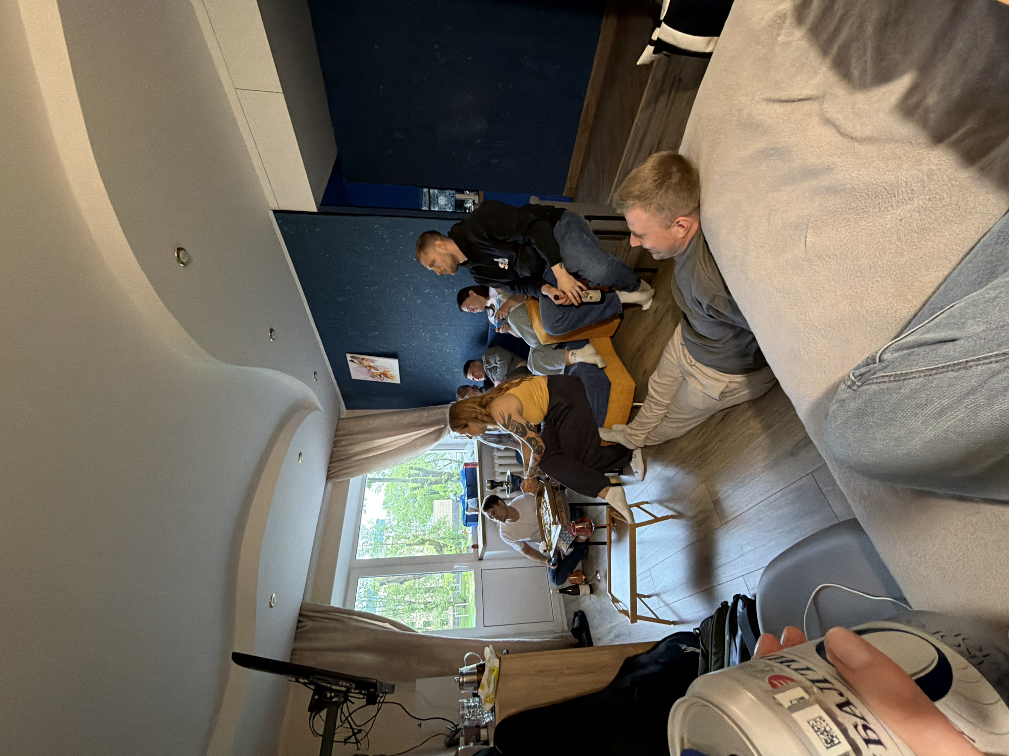 Group shares pizza during indoor circle gathering