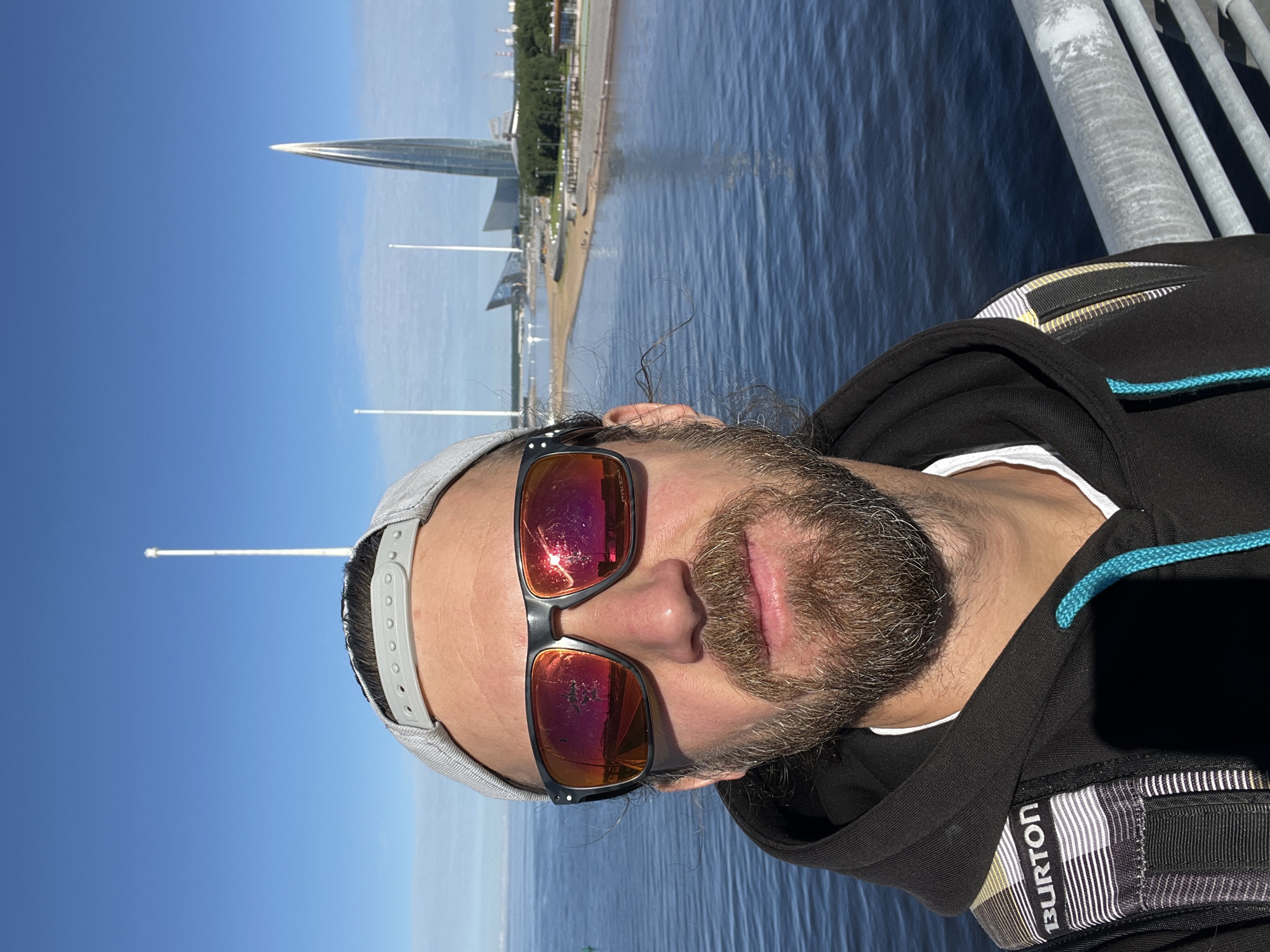 Waterfront moment with Lakhta Center on the horizon