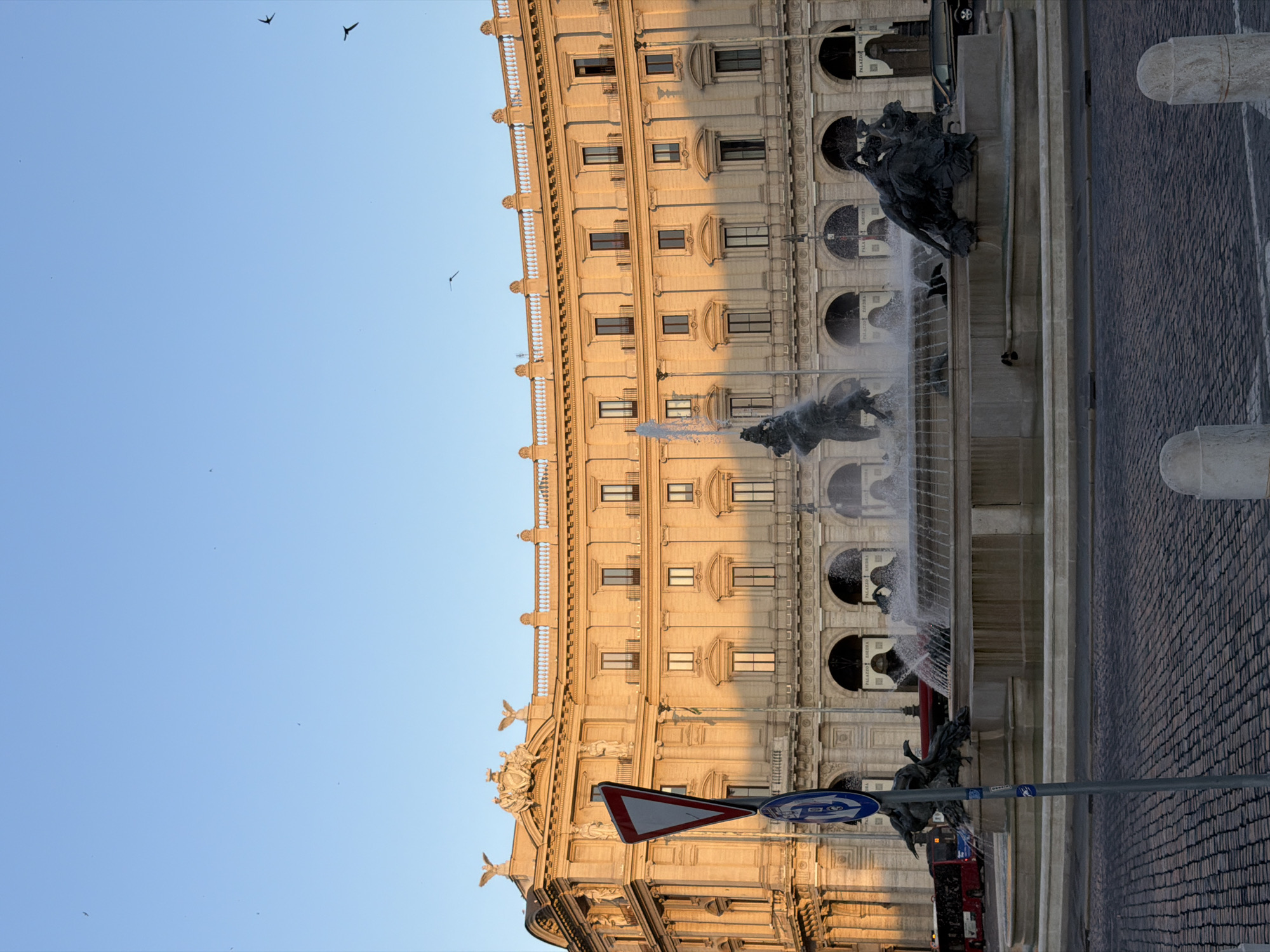Ornate Roman plaza fountain at dusk, multiple angles