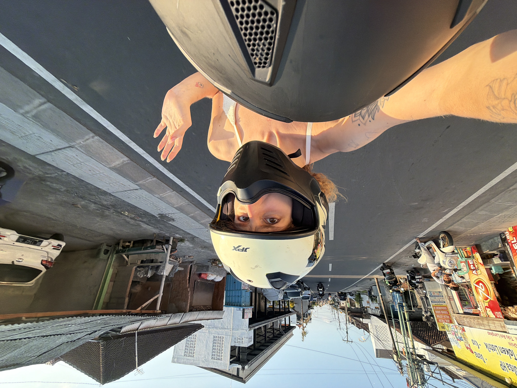 Motorcycle selfies taken mid-ride through Mengwi streets