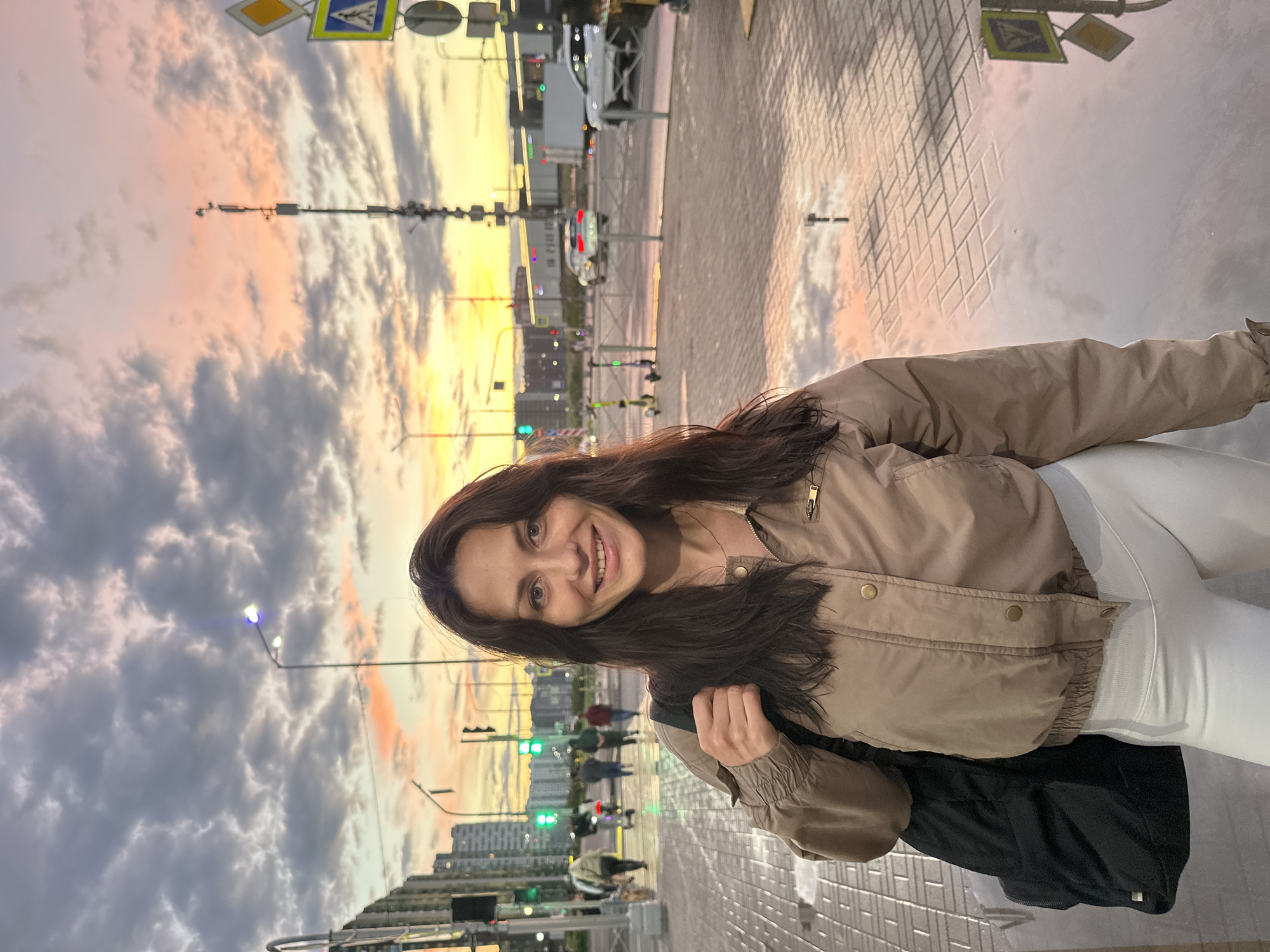 Dusk puddle reflections, a neon gym, and a Yandex delivery robot