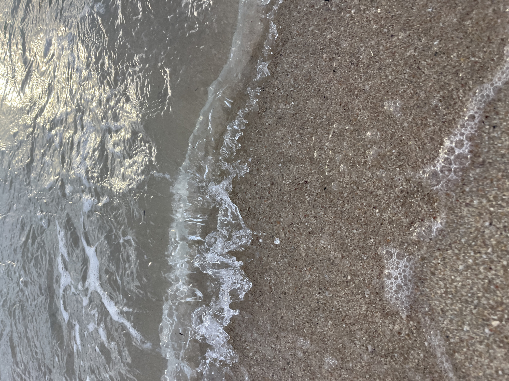 Lazy morning on Ko Samui's beach — yoga, kayaking, and shoreline light
