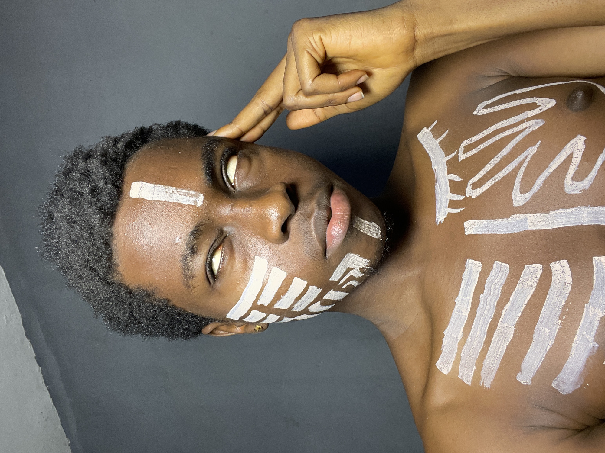 Man with traditional white body paint observed in Nkpor