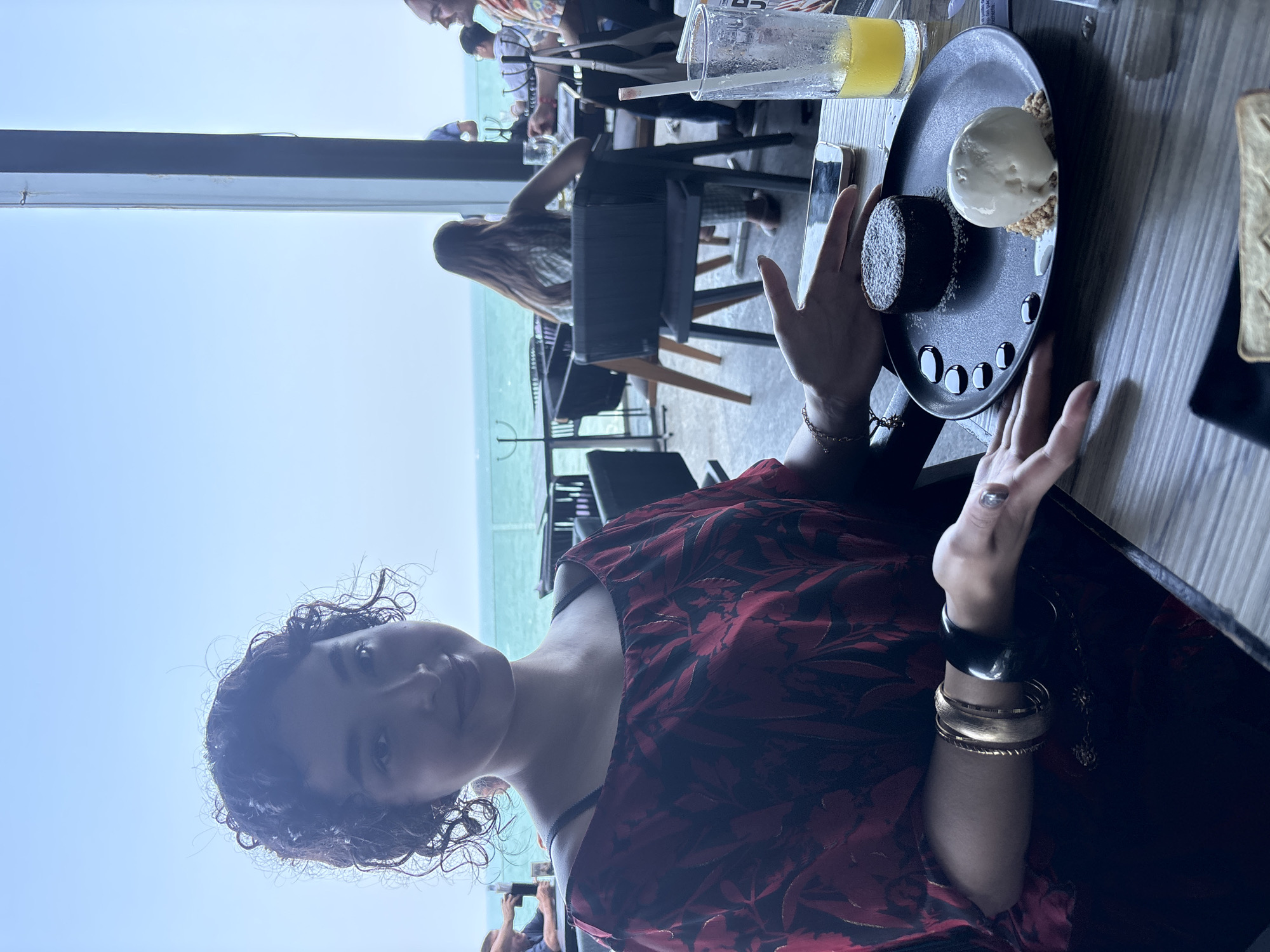 Woman enjoys chocolate dessert at Veracruz oceanfront restaurant