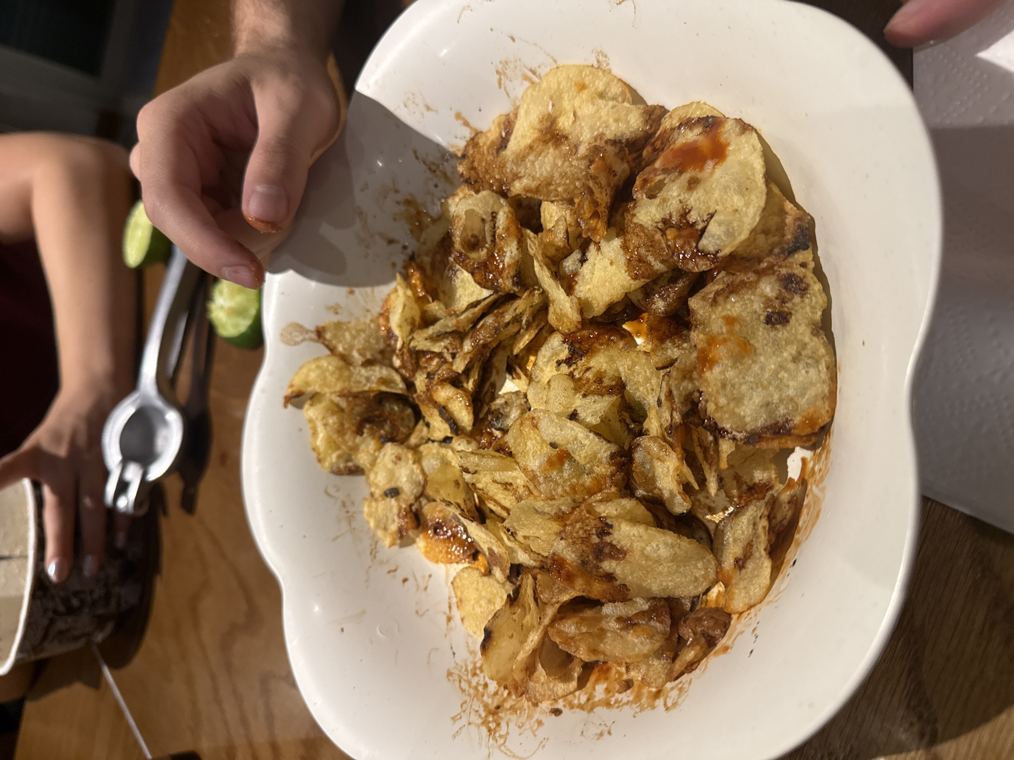 Bowl of potato chips observed during indoor snacking moment